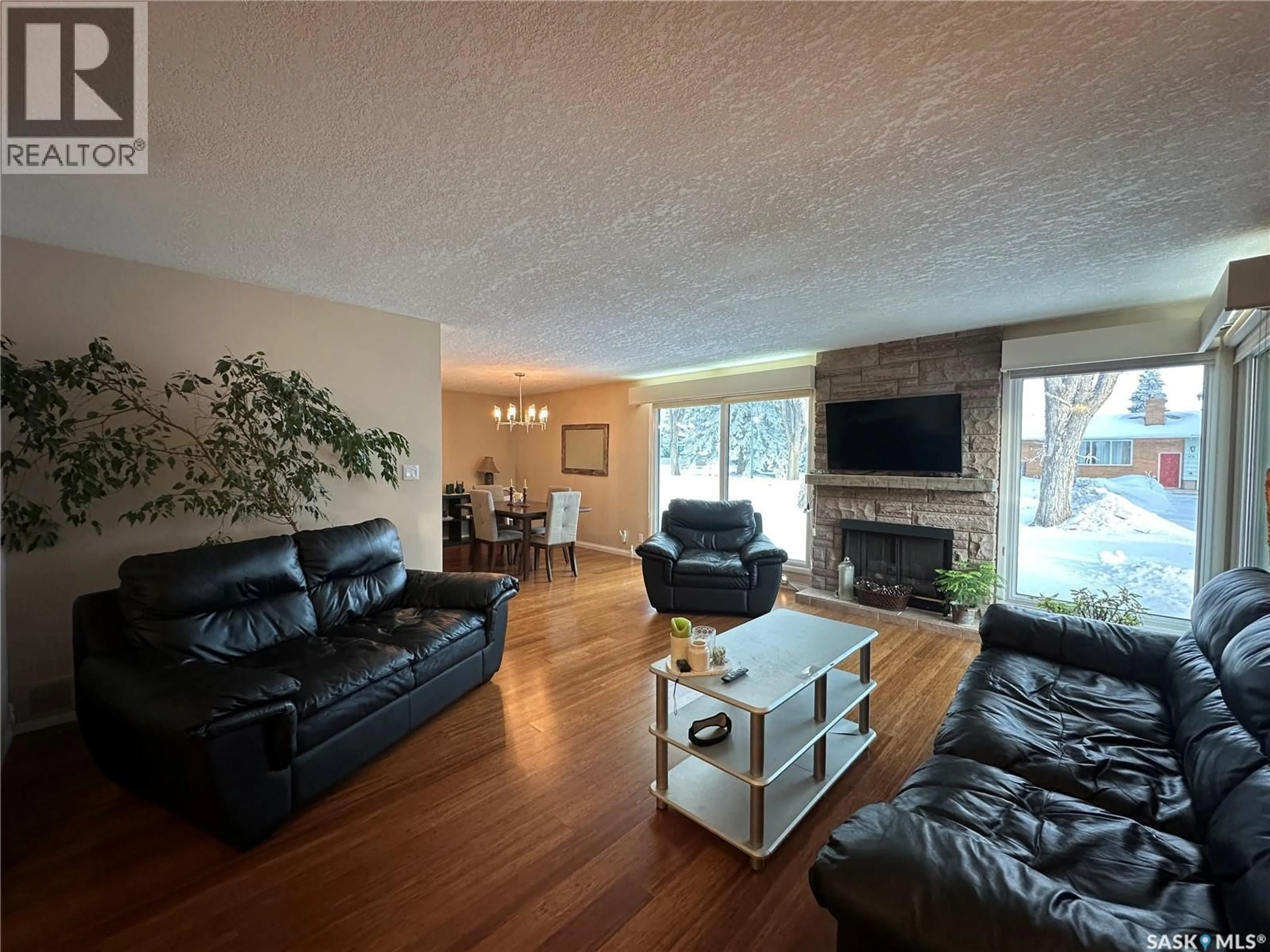 Living room with furniture, wood/laminate floor for 114 GARVIN CRESCENT, Canora Saskatchewan S0A0L0