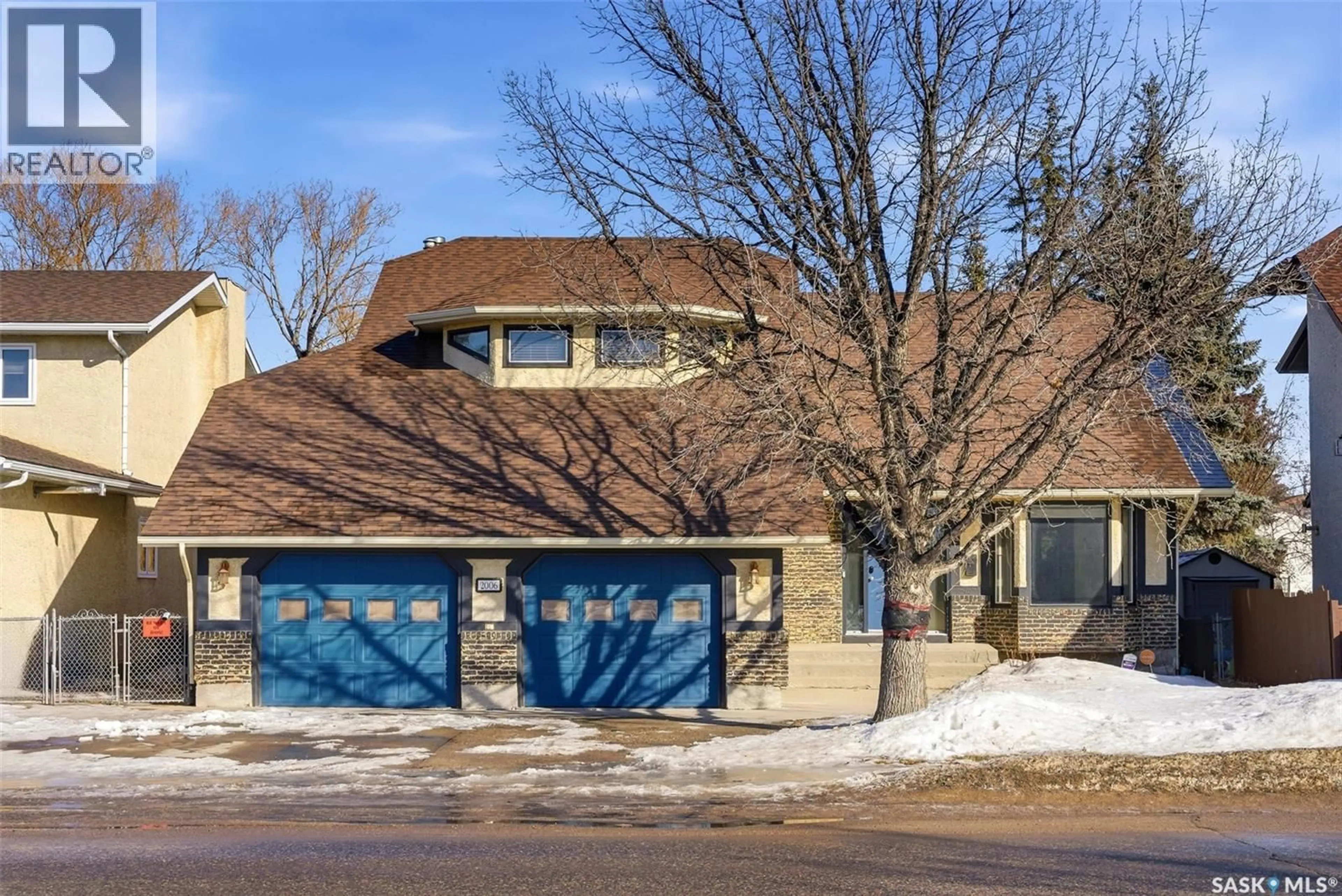 Home with brick exterior material, street for 2006 ASSINIBOINE AVENUE, Regina Saskatchewan S4V2E2