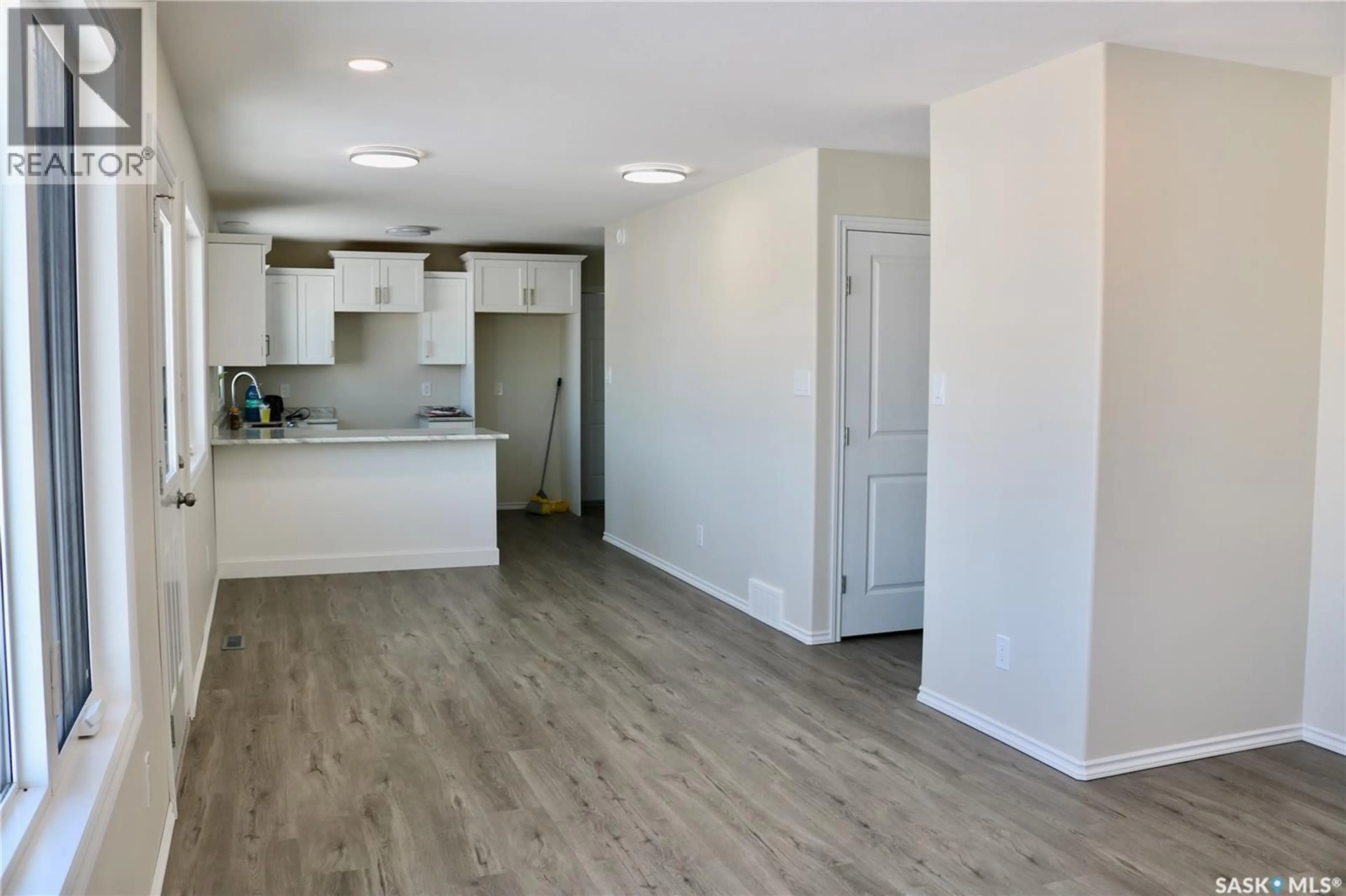Open concept kitchen, wood/laminate floor for 511 1ST AVENUE, Wapella Saskatchewan S0G4Z0