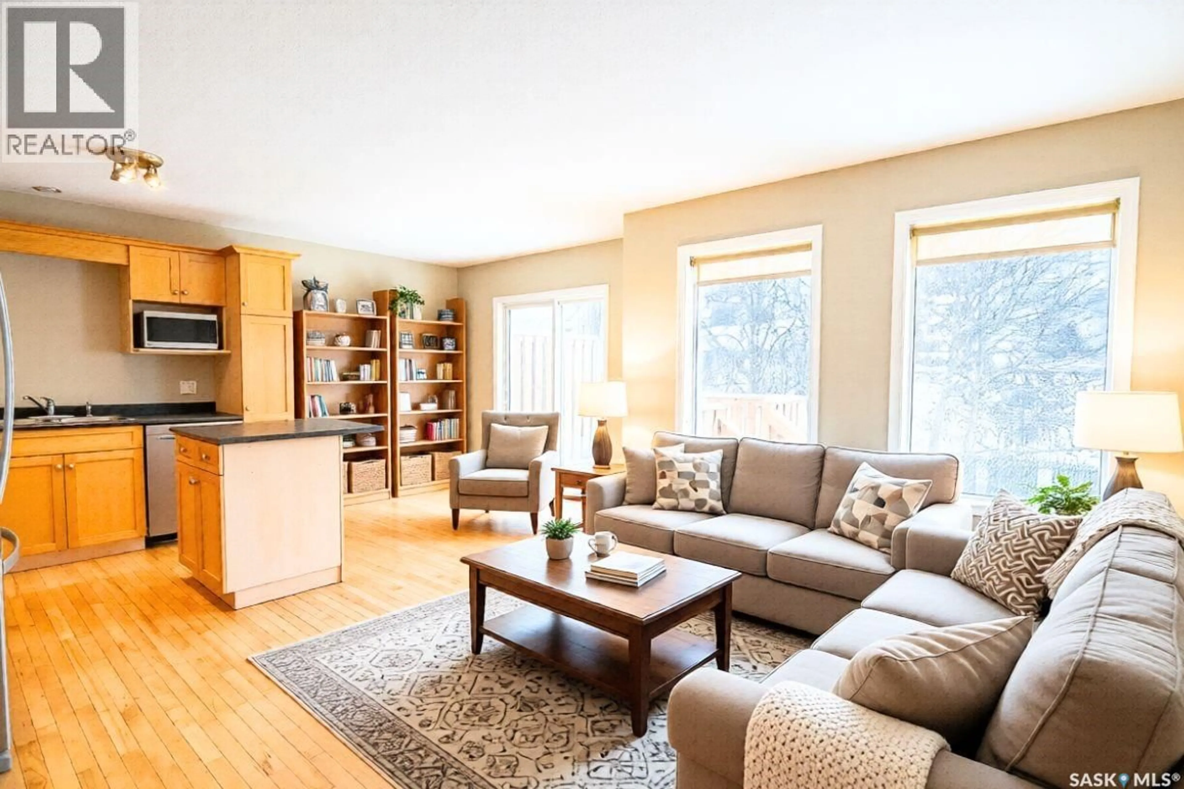 Living room with furniture, wood/laminate floor for 27 - 1620 OLIVE DIEFENBAKER DRIVE, Prince Albert Saskatchewan S6X1C5