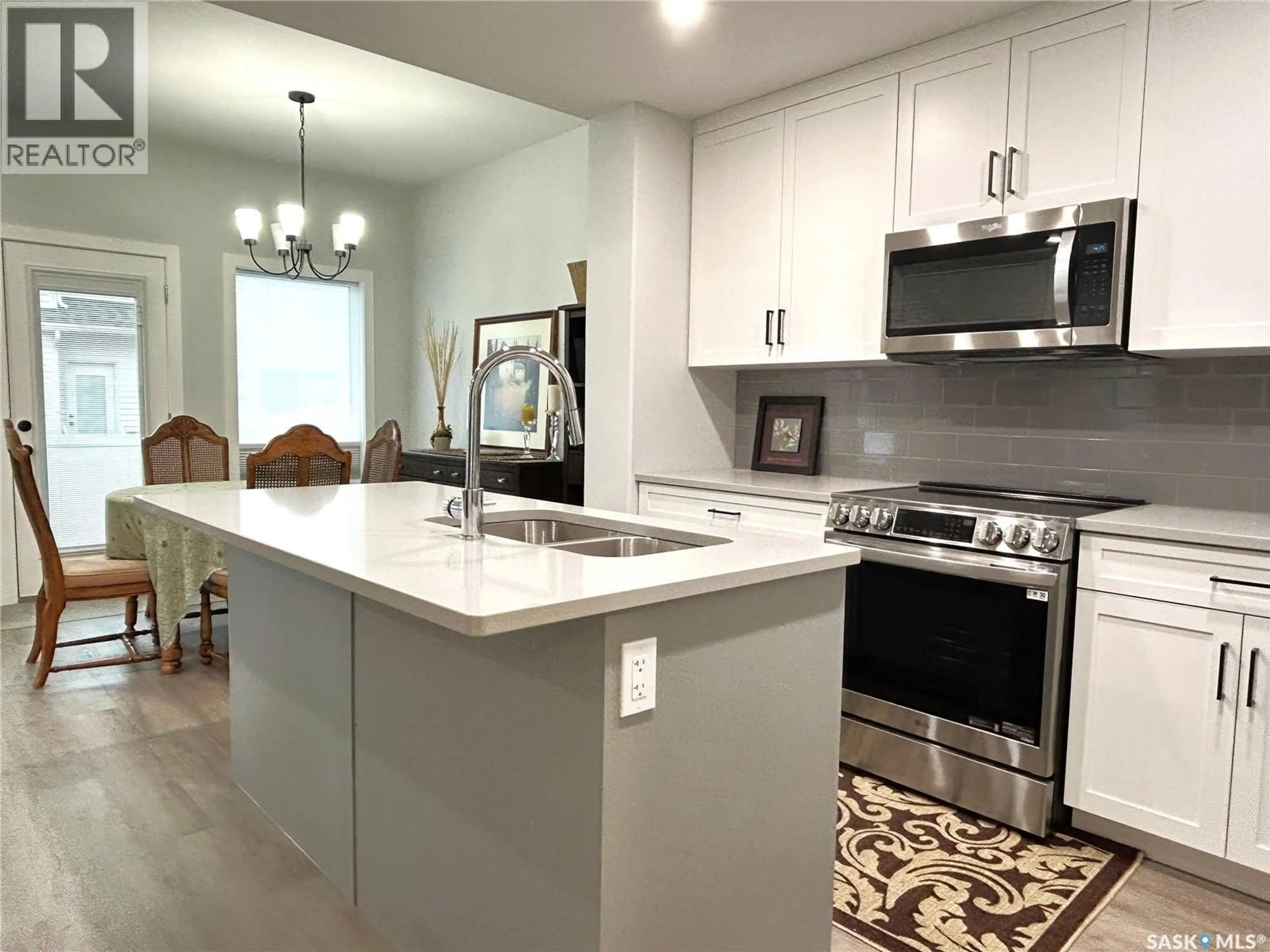 Open concept kitchen, unknown for 9 115 FEHEREGYHAZI BOULEVARD, Saskatoon Saskatchewan S7W1J6