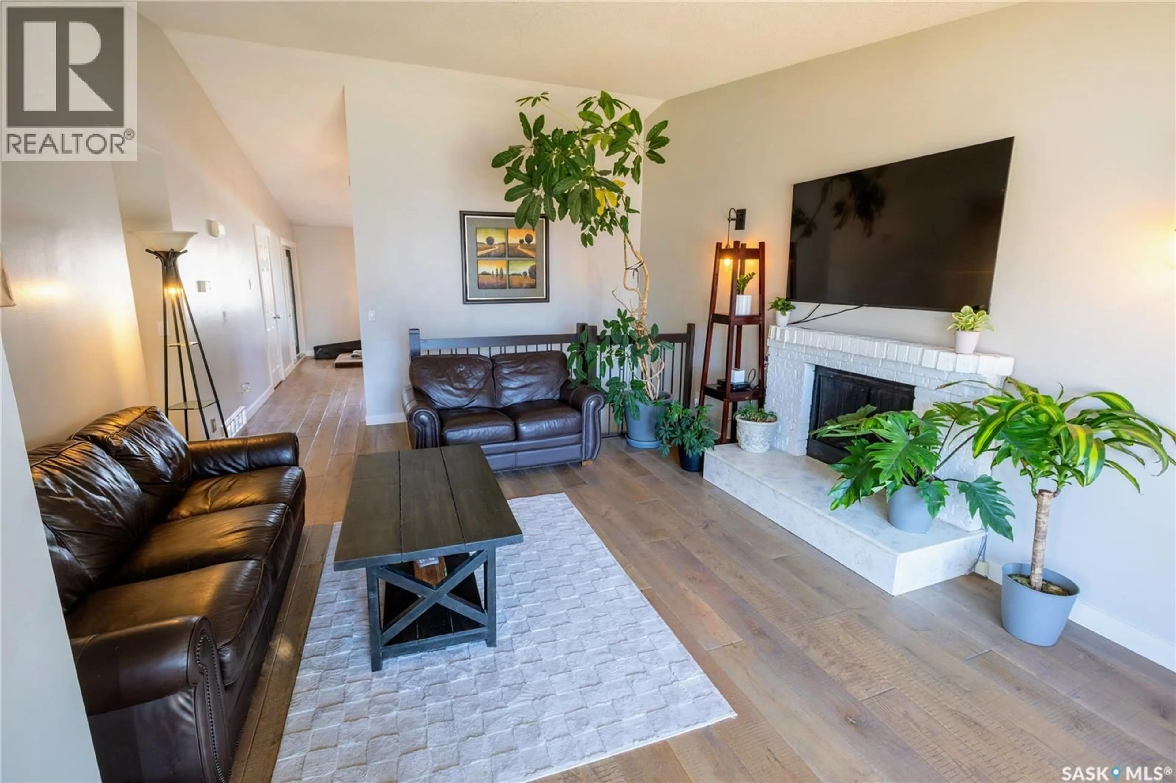 Living room with furniture, wood/laminate floor for 1612 DUNN STREET, Moose Jaw Saskatchewan S6H7B1