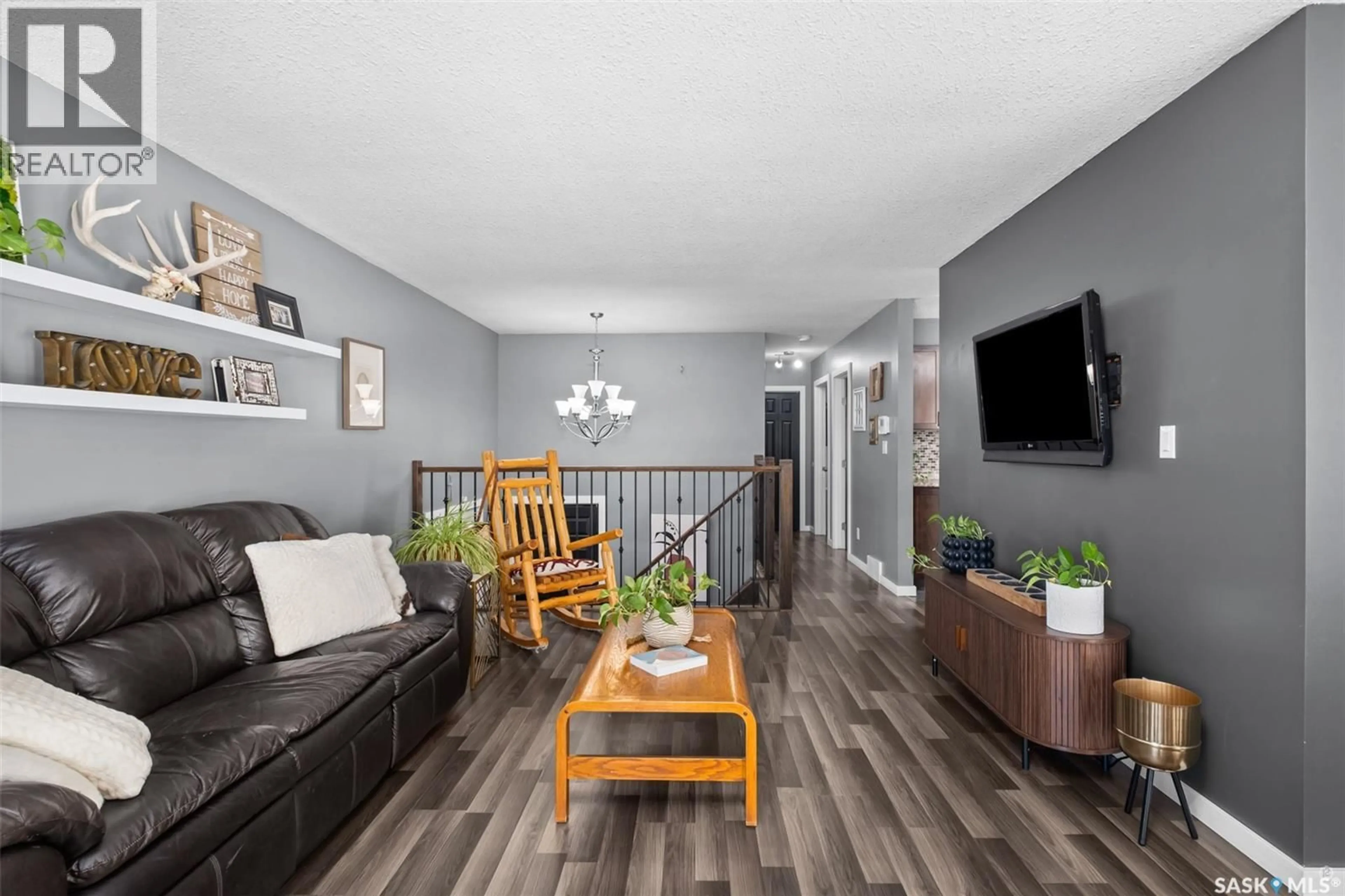 Living room with furniture, wood/laminate floor for 866 SPENCER DRIVE, Prince Albert Saskatchewan S6V7C9