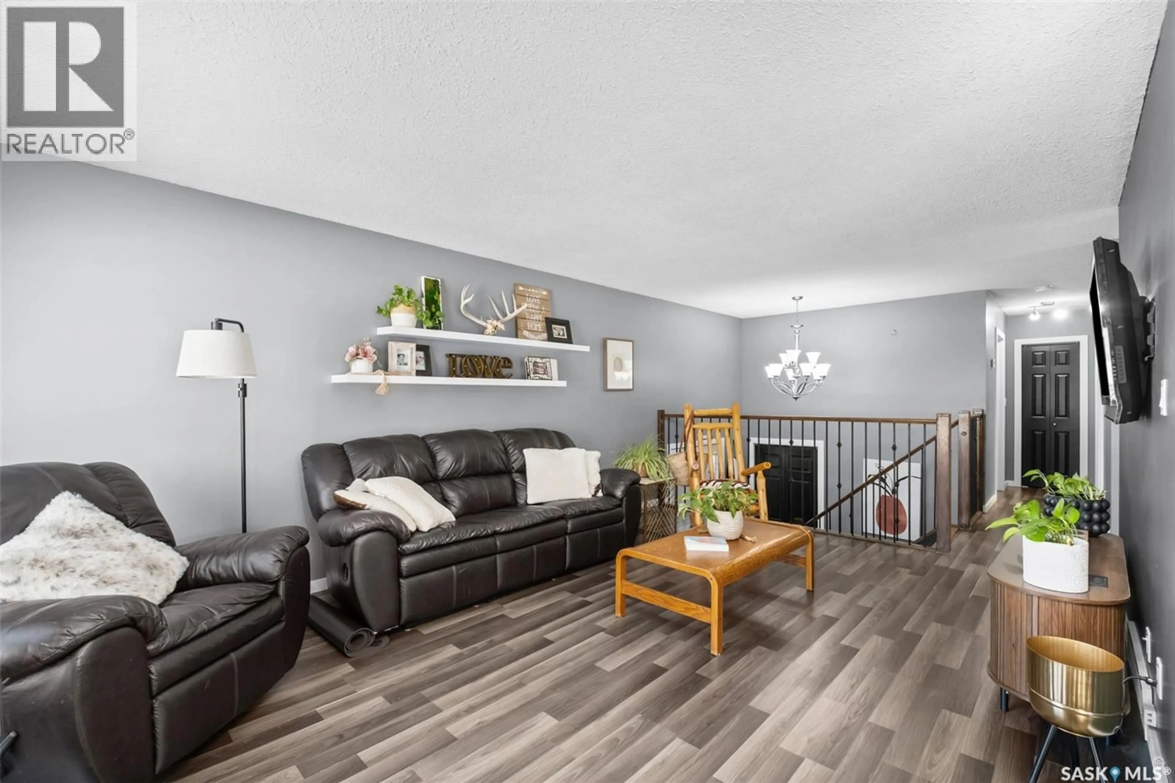 Living room with furniture, wood/laminate floor for 866 SPENCER DRIVE, Prince Albert Saskatchewan S6V7C9