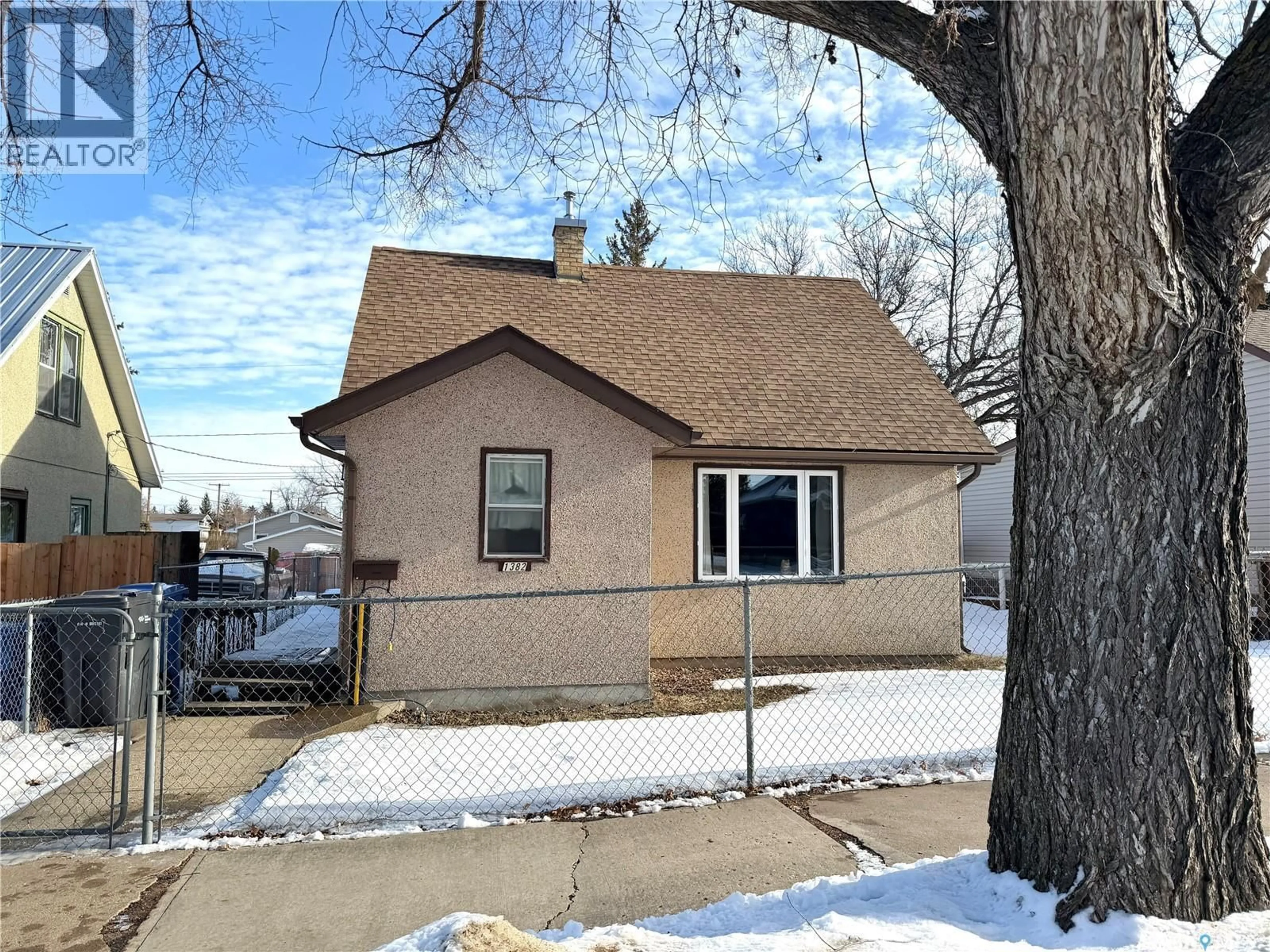 Home with vinyl exterior material, street for 1382 107TH STREET, North Battleford Saskatchewan S9A1Z7