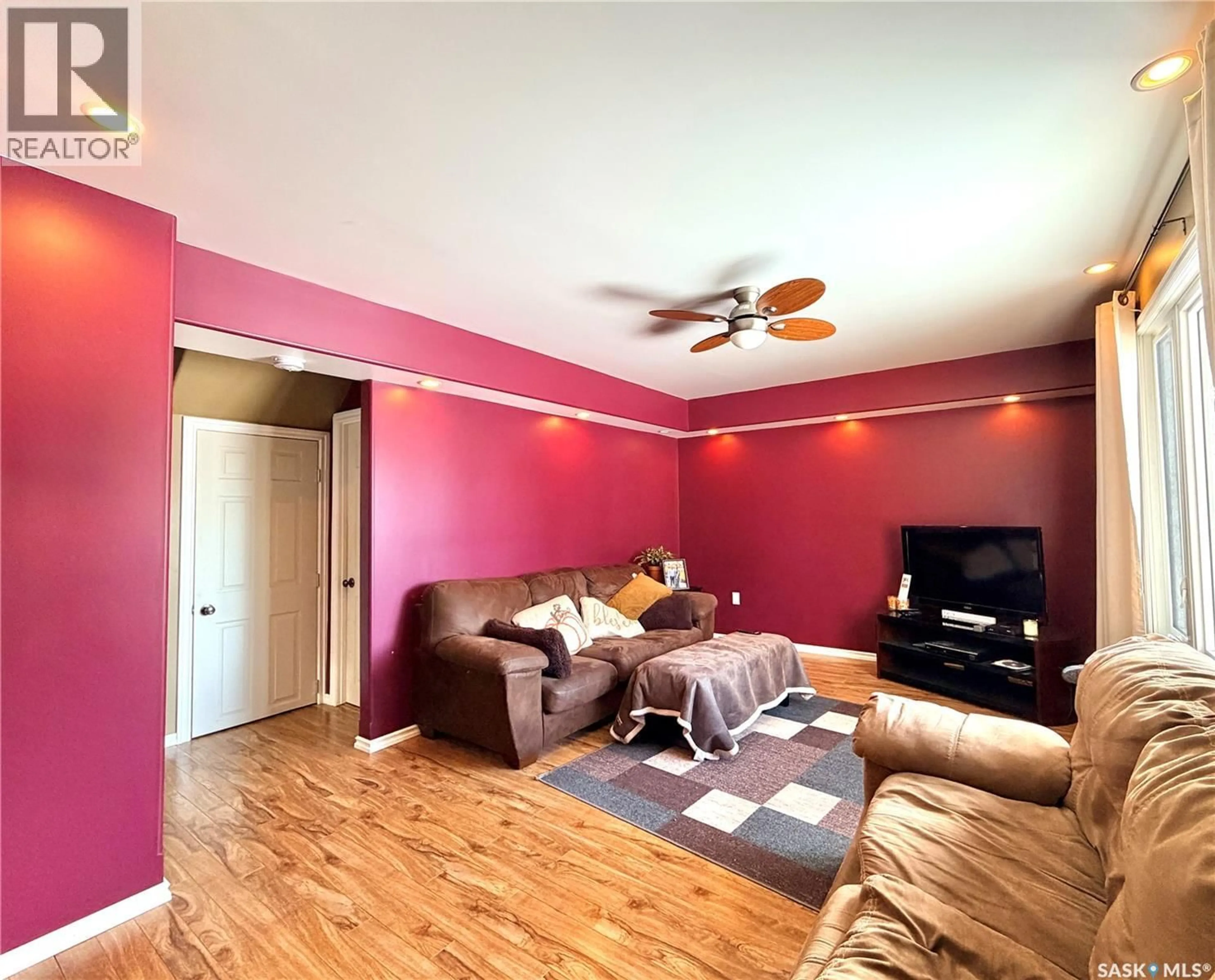 Living room with furniture, wood/laminate floor for 1382 107TH STREET, North Battleford Saskatchewan S9A1Z7