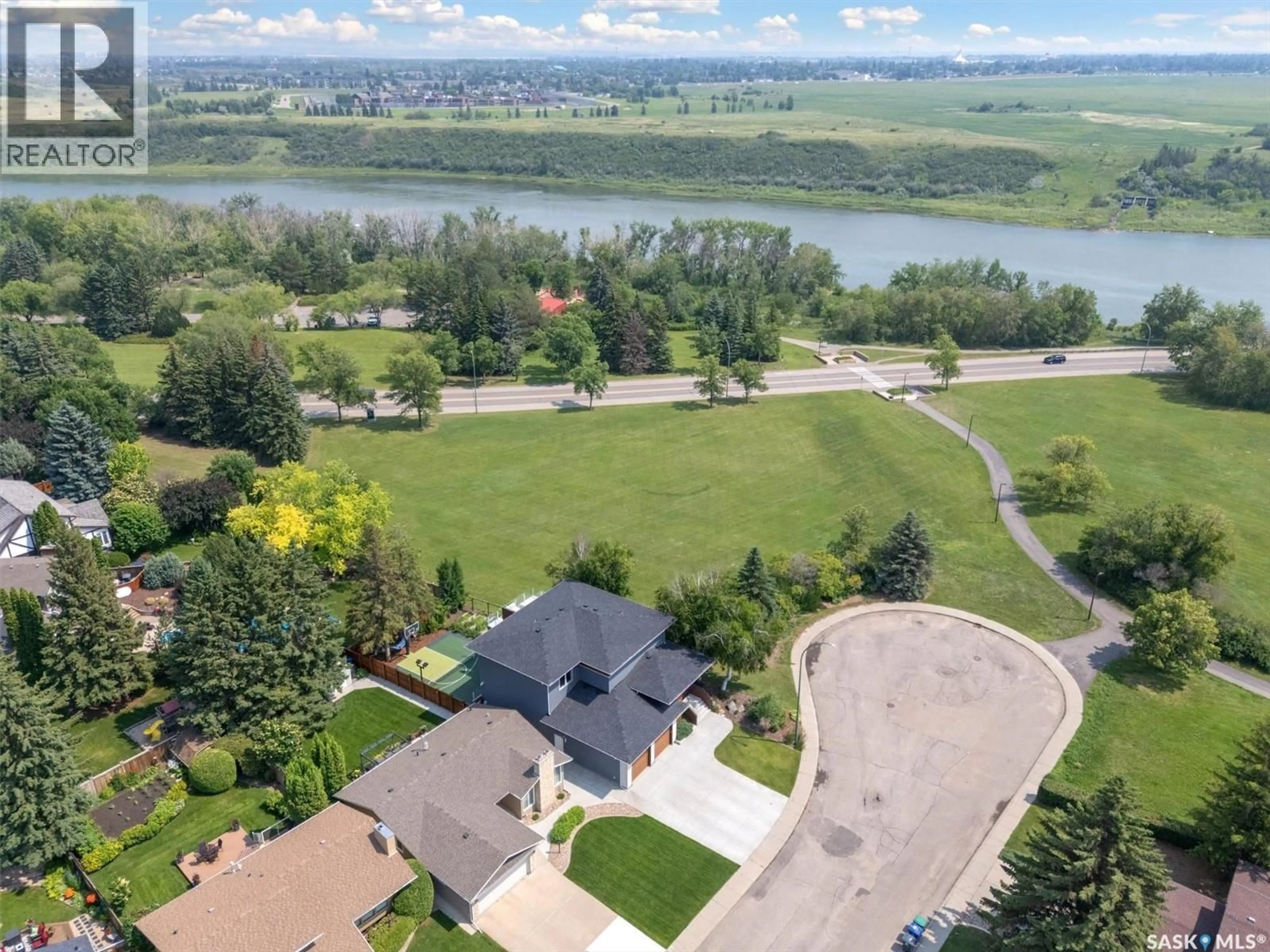 A pic from outside/outdoor area/front of a property/back of a property/a pic from drone, water/lake/river/ocean view for 103 SAGUENAY DRIVE, Saskatoon Saskatchewan S7K4M8