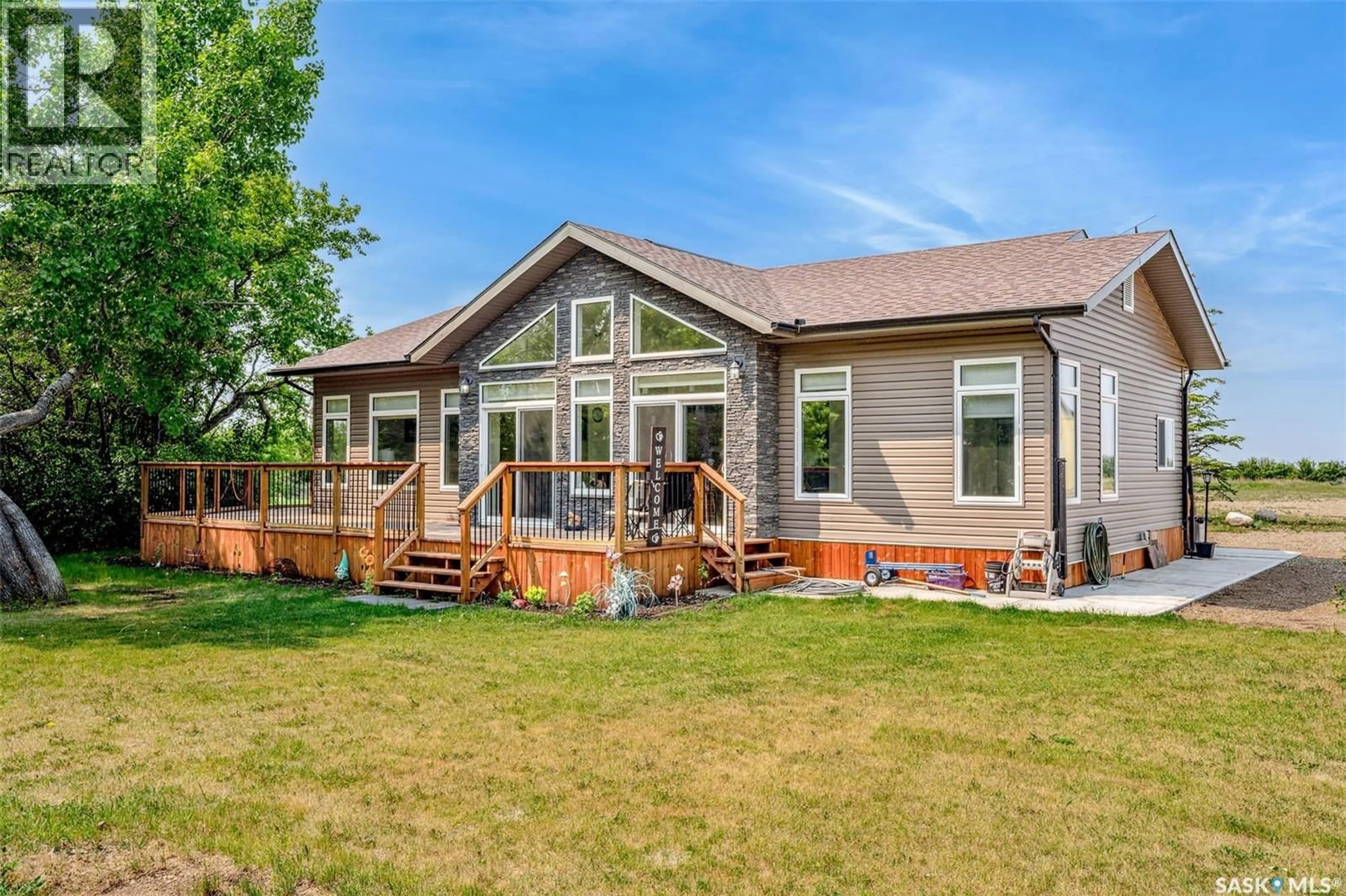 Home with vinyl exterior material, mountain view for NAICAM ACREAGE, Spalding Rm No. 368 Saskatchewan S0K2Z0