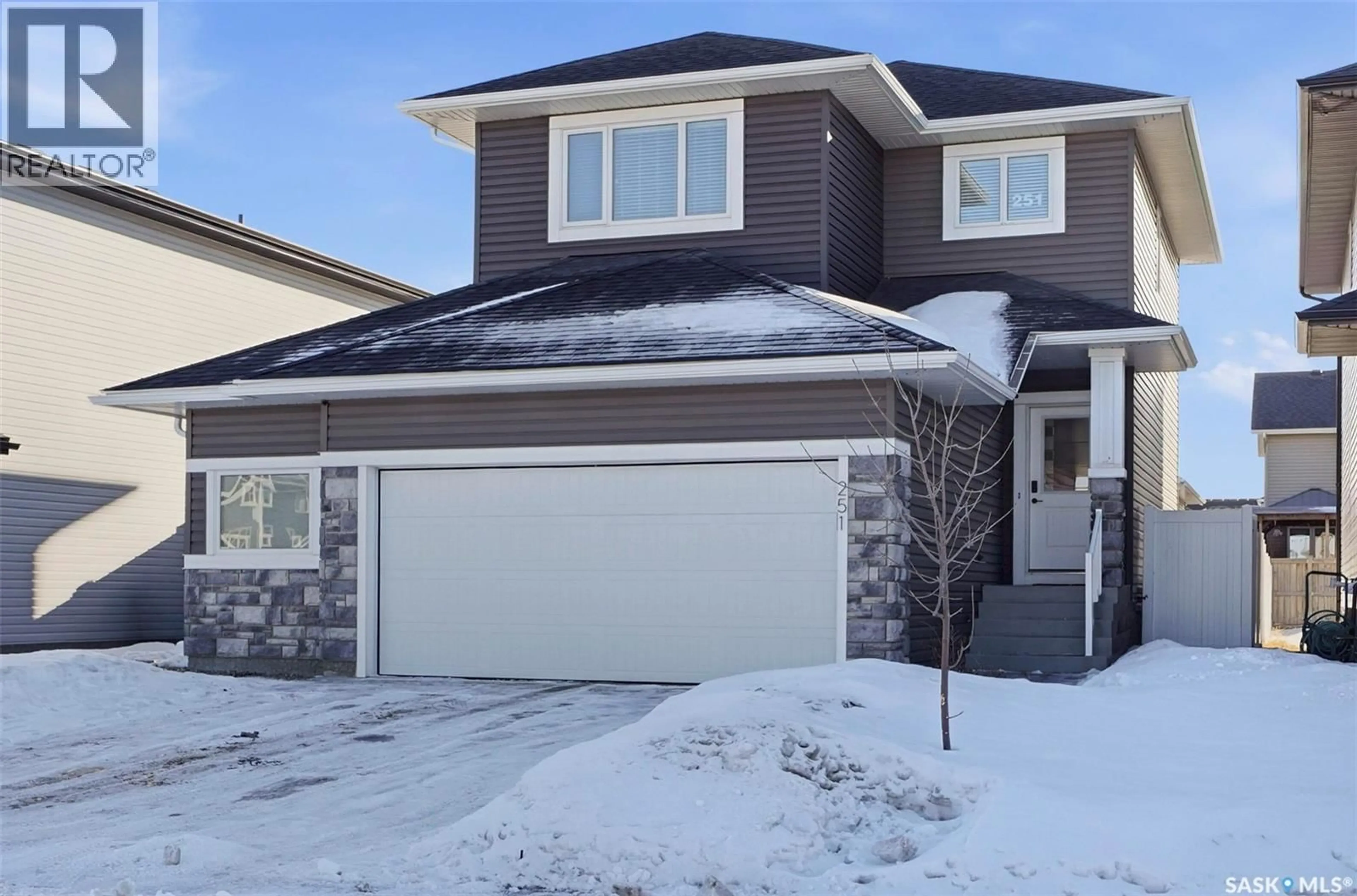 Home with vinyl exterior material, street for 251 LABINE BEND, Saskatoon Saskatchewan S7L5Y5