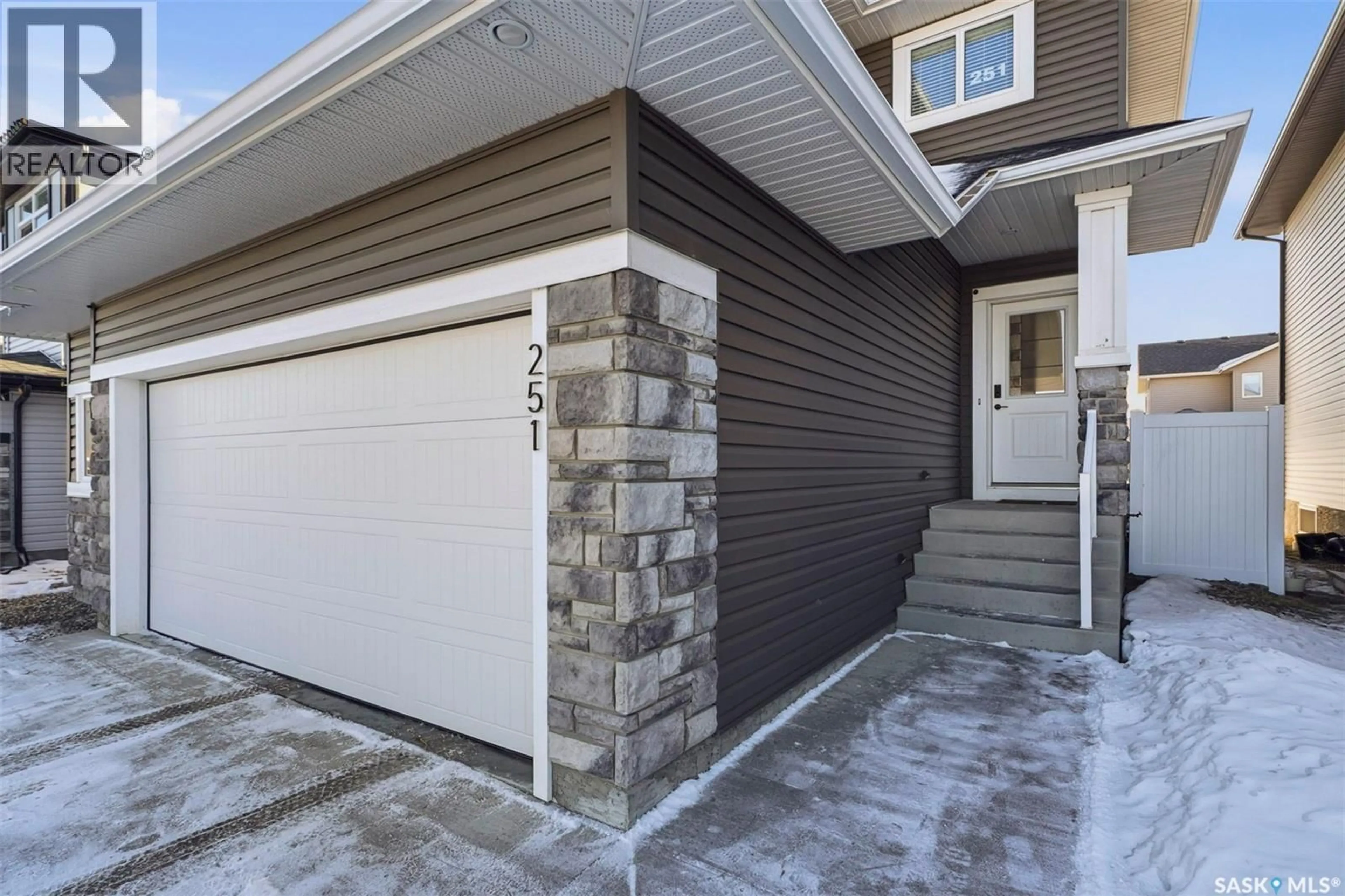 Home with vinyl exterior material, street for 251 LABINE BEND, Saskatoon Saskatchewan S7L5Y5