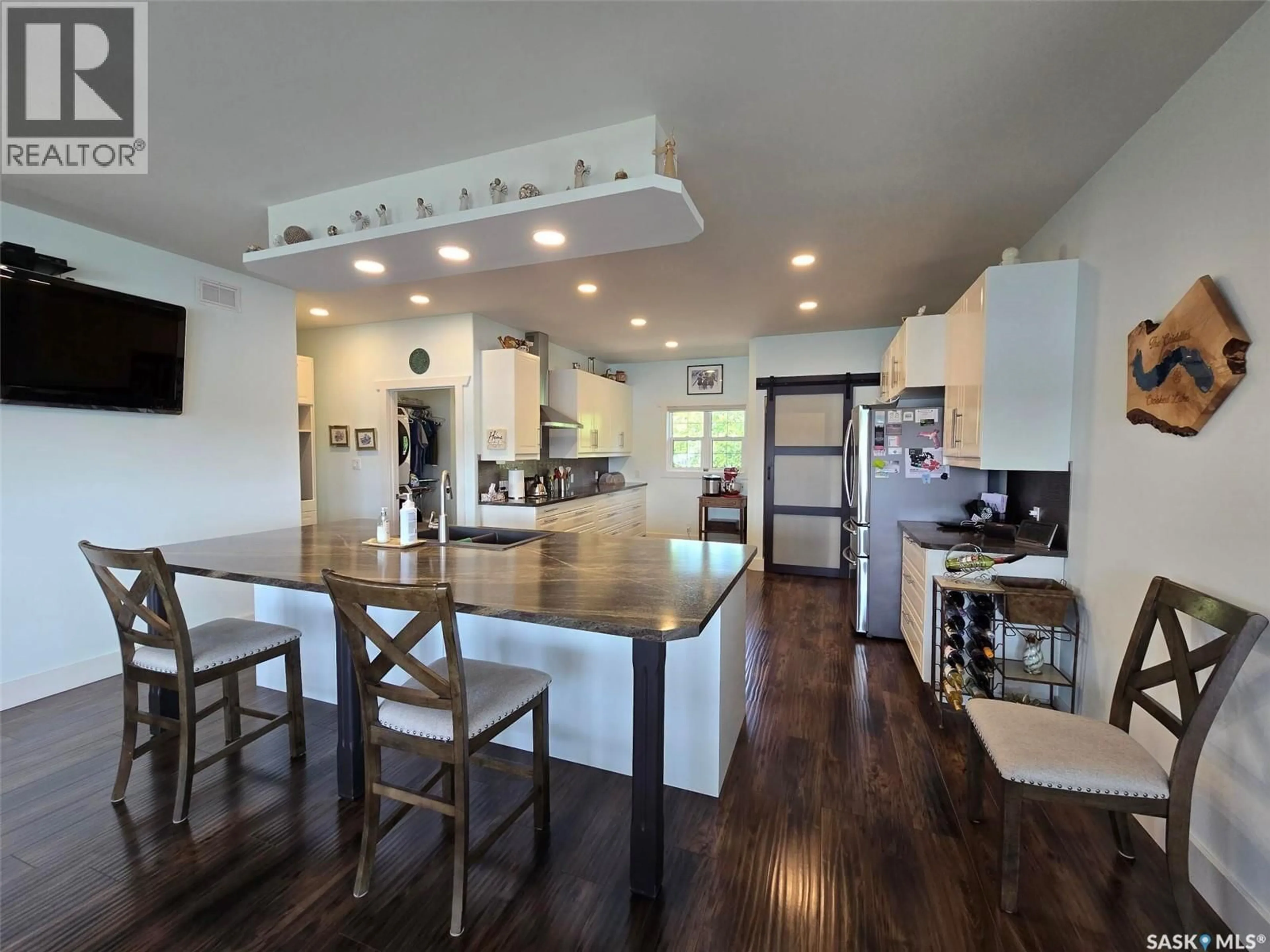 Open concept kitchen, wood/laminate floor for 207 CRIDDLE AVENUE, Crooked Lake Provincial Park Saskatchewan S0G2B0