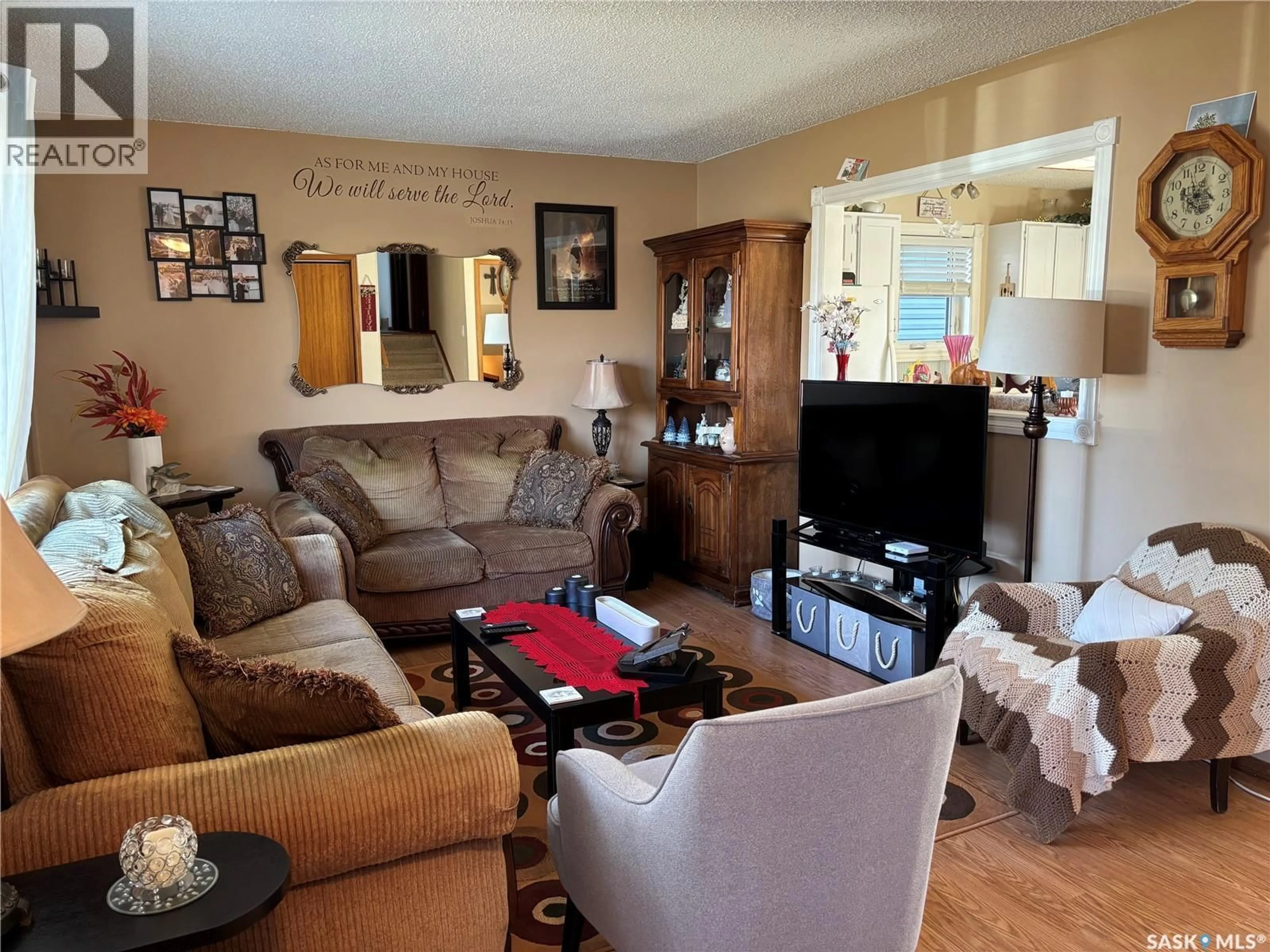 Living room with furniture, wood/laminate floor for 1159 HOCHELAGA STREET, Moose Jaw Saskatchewan S6H2J3