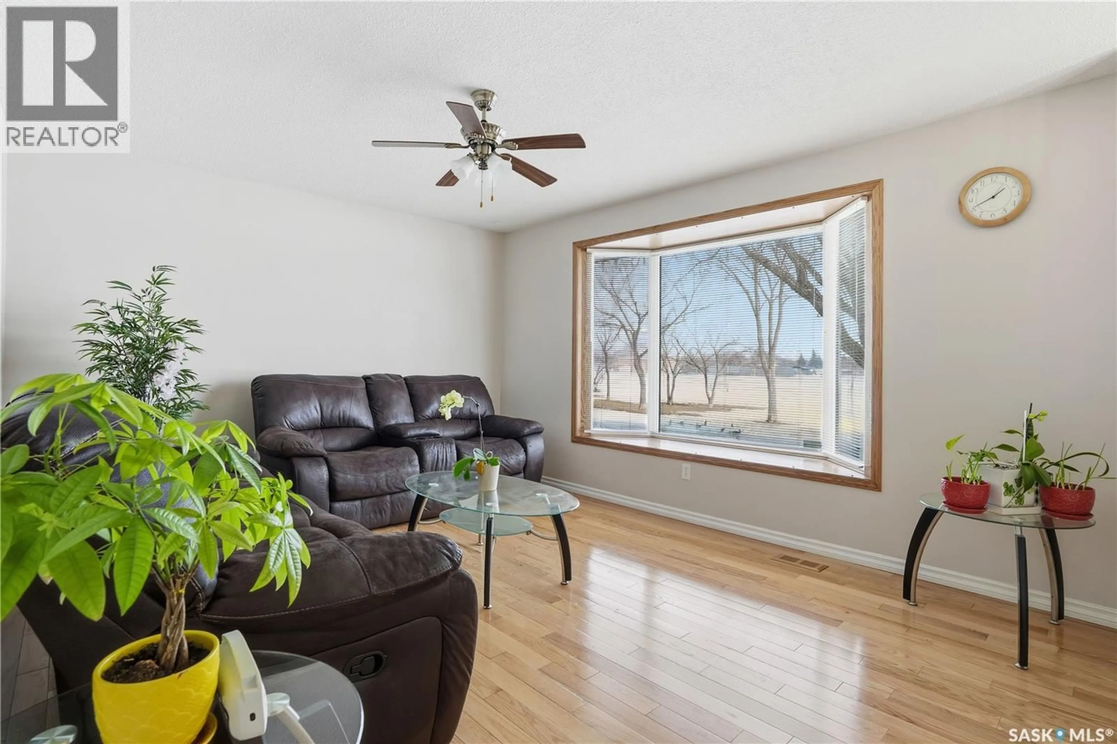 Living room with furniture, wood/laminate floor for 46 LYONS STREET, Regina Saskatchewan S4T6G2