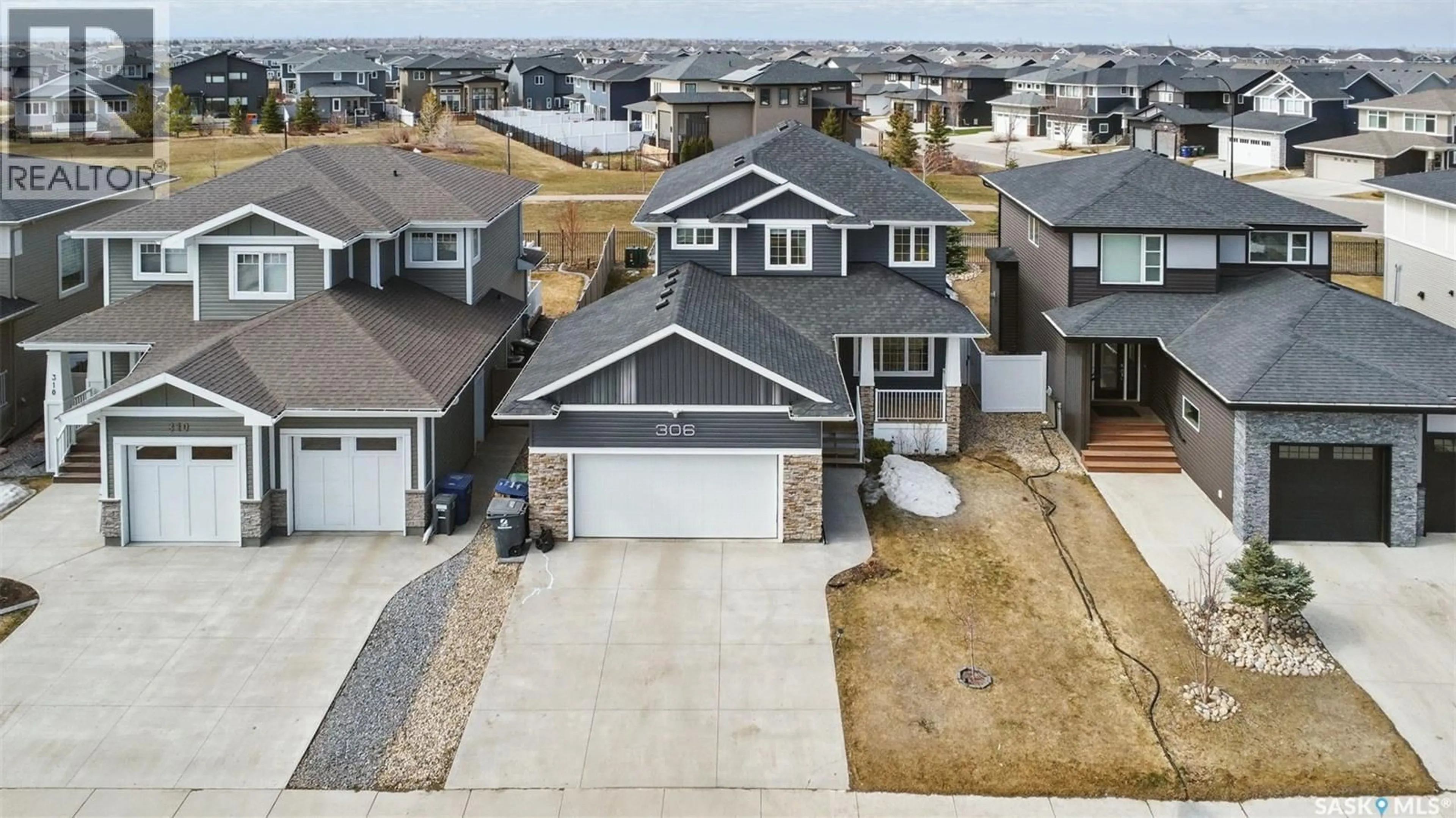 A pic from outside/outdoor area/front of a property/back of a property/a pic from drone, street for 306 SECORD WAY, Saskatoon Saskatchewan S7V0L9