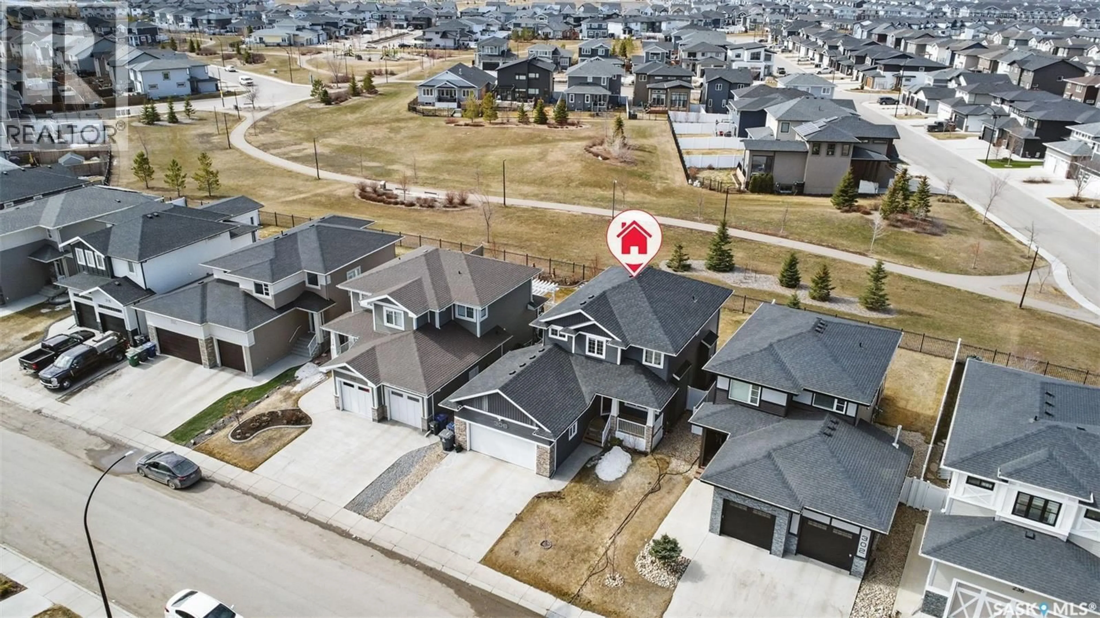 A pic from outside/outdoor area/front of a property/back of a property/a pic from drone, street for 306 SECORD WAY, Saskatoon Saskatchewan S7V0L9