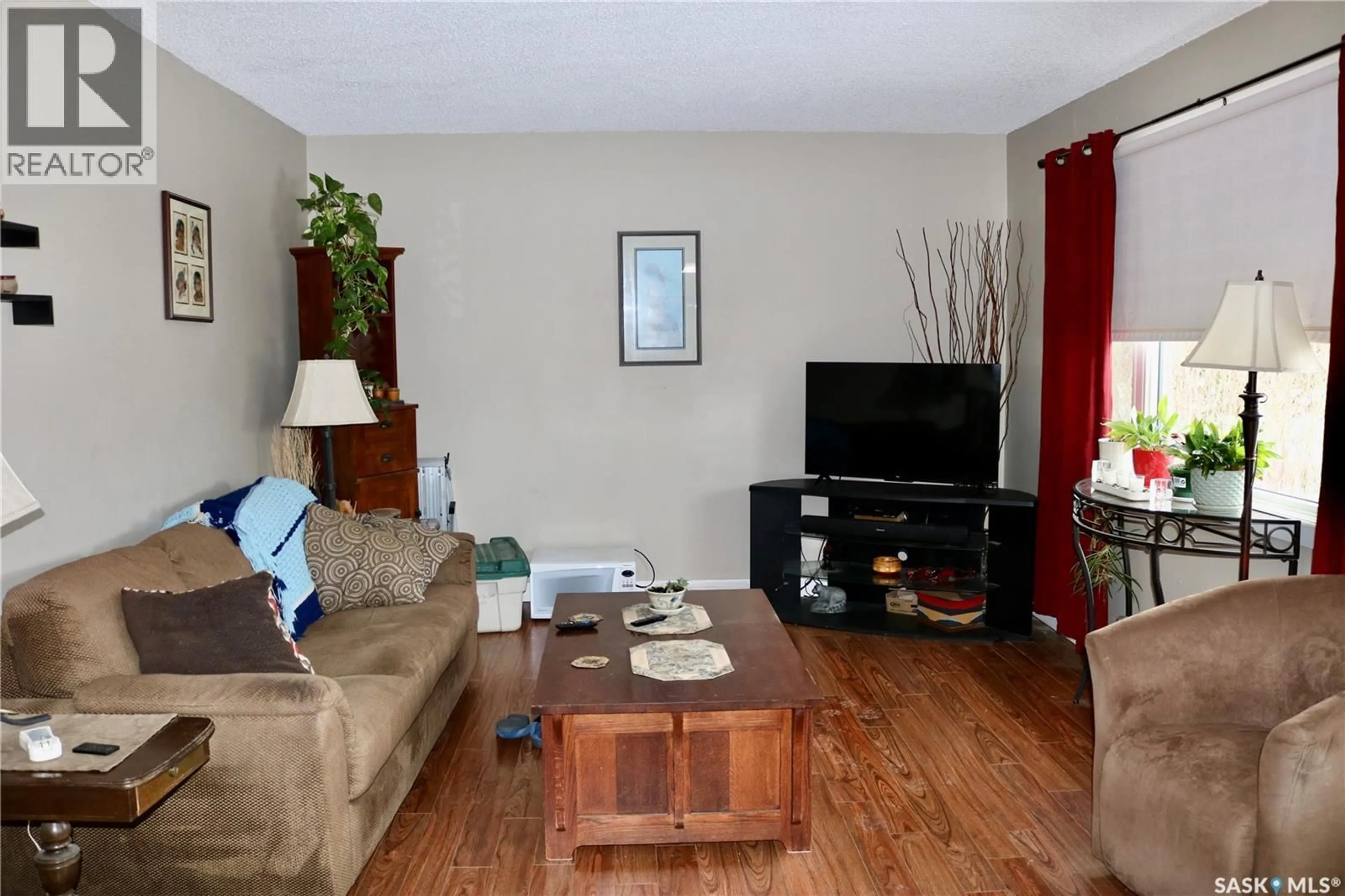 Living room with furniture, wood/laminate floor for 105 GARRY STREET, Rocanville Saskatchewan S0G3N0