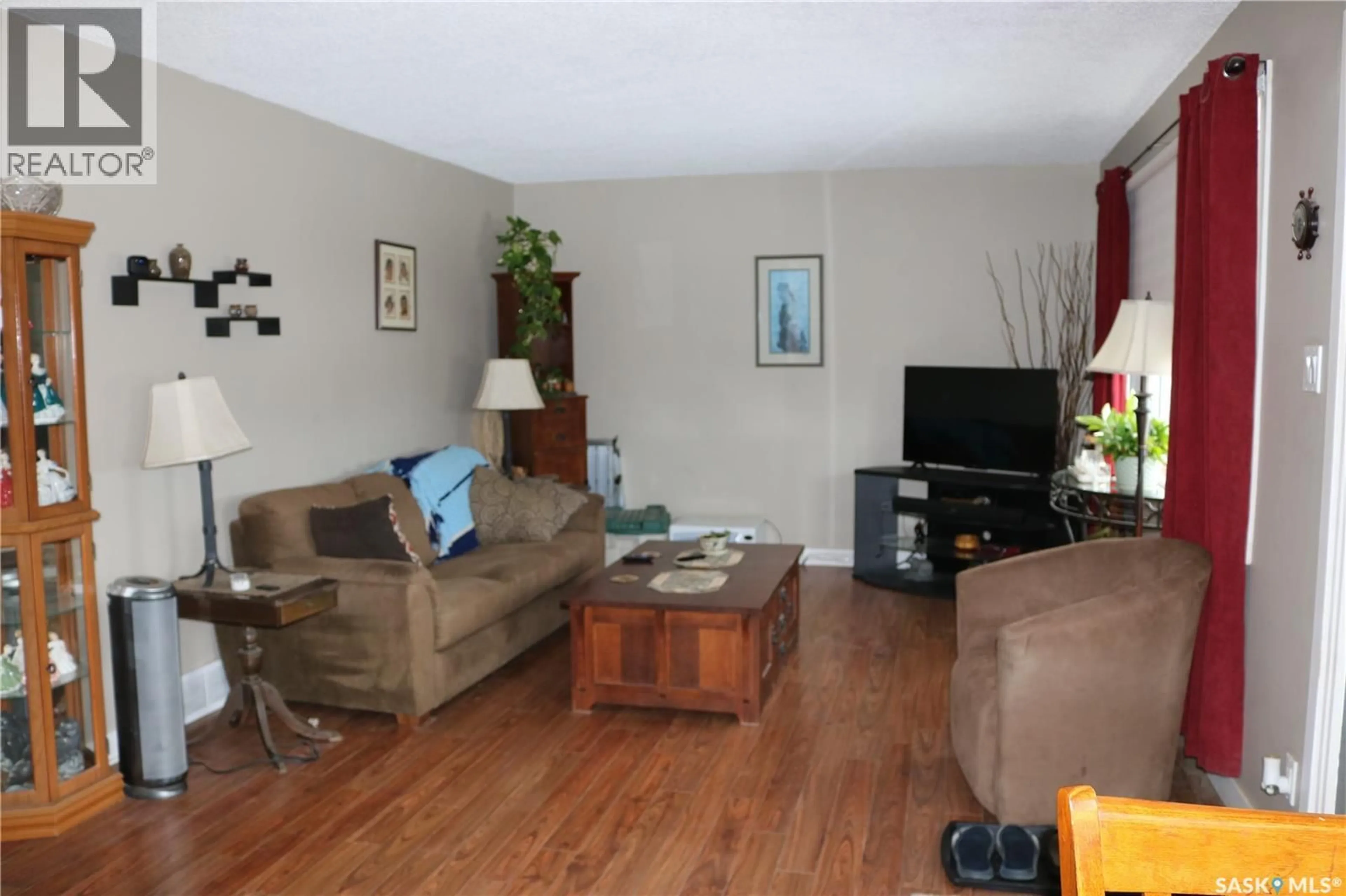 Living room with furniture, wood/laminate floor for 105 GARRY STREET, Rocanville Saskatchewan S0G3N0