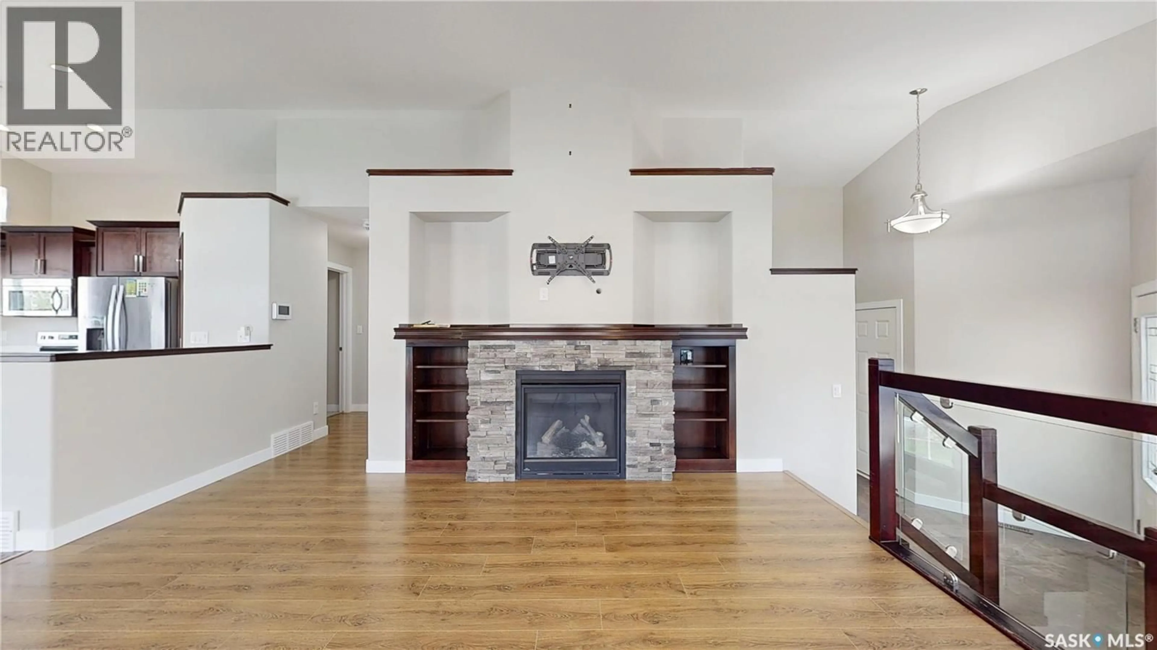 Living room with furniture, wood/laminate floor for 5614 BEACON PLACE, Regina Saskatchewan S4W0J7