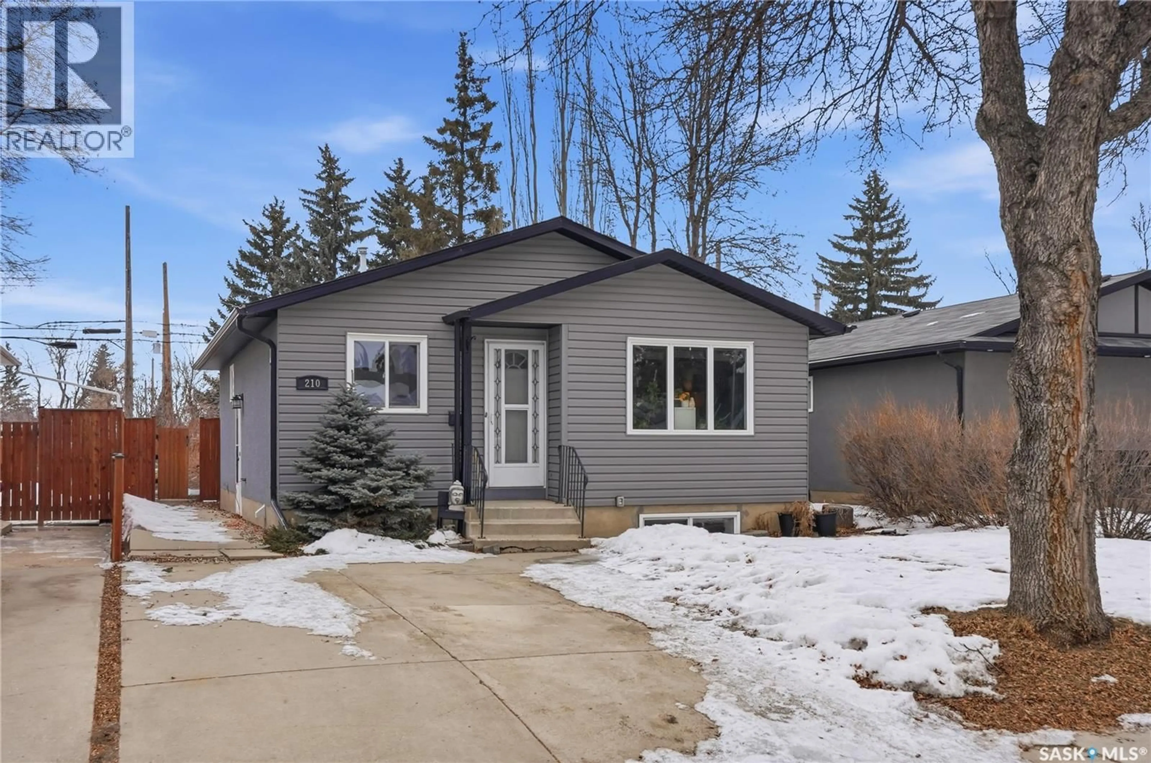Home with vinyl exterior material, street for 210 113TH STREET, Saskatoon Saskatchewan S7N2L1