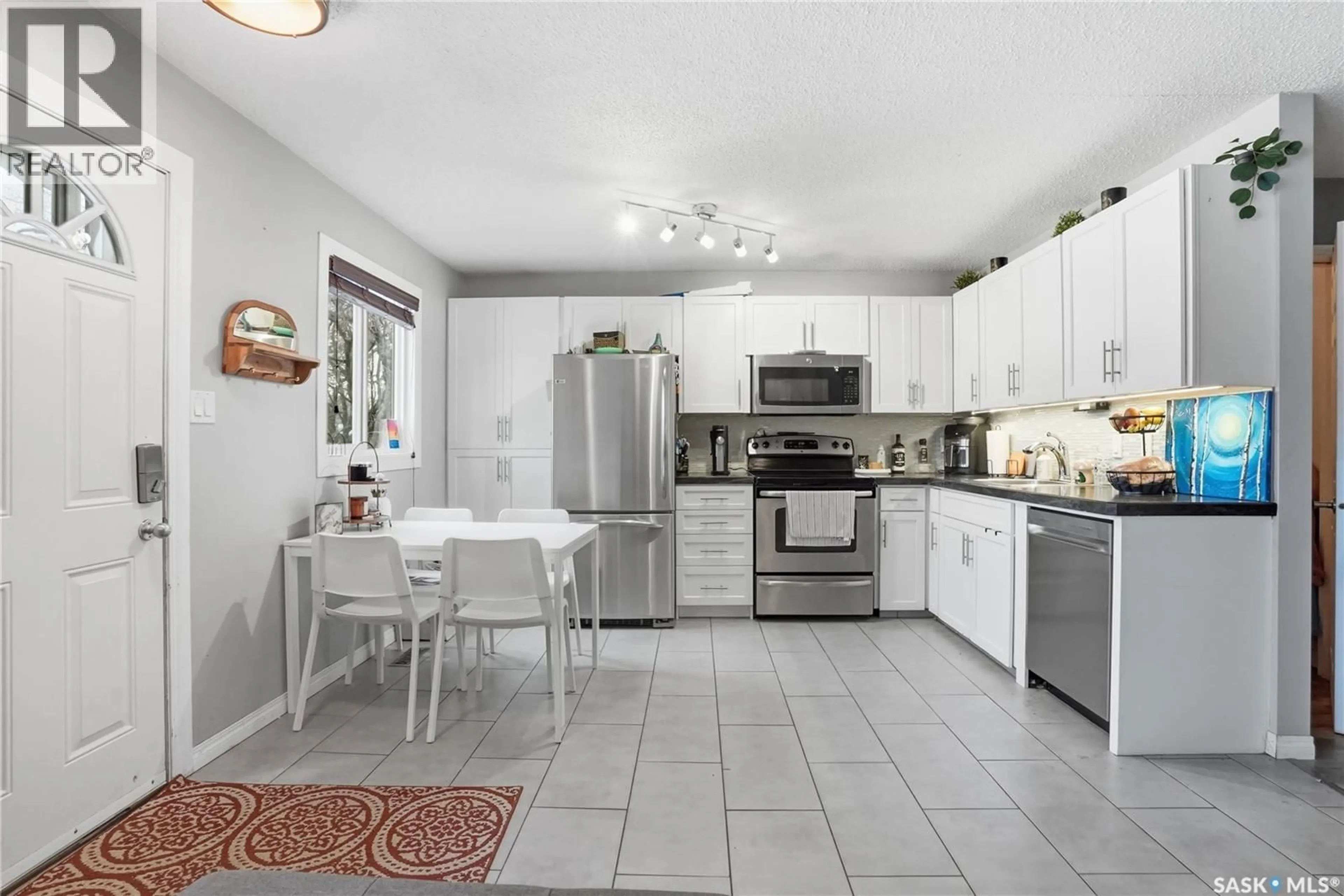 Open concept kitchen, ceramic/tile floor for 210 113TH STREET, Saskatoon Saskatchewan S7N2L1