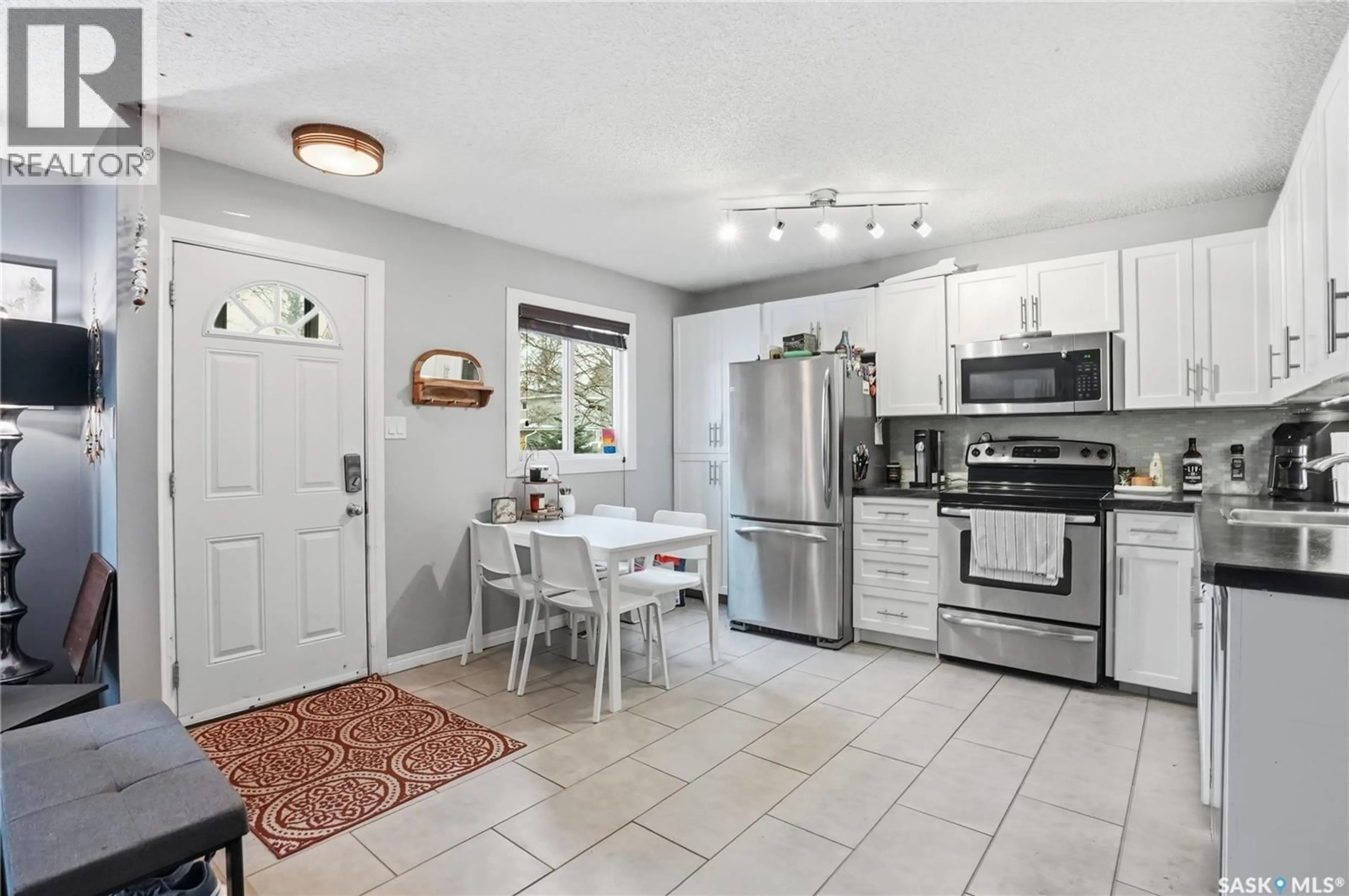 Open concept kitchen, ceramic/tile floor for 210 113TH STREET, Saskatoon Saskatchewan S7N2L1