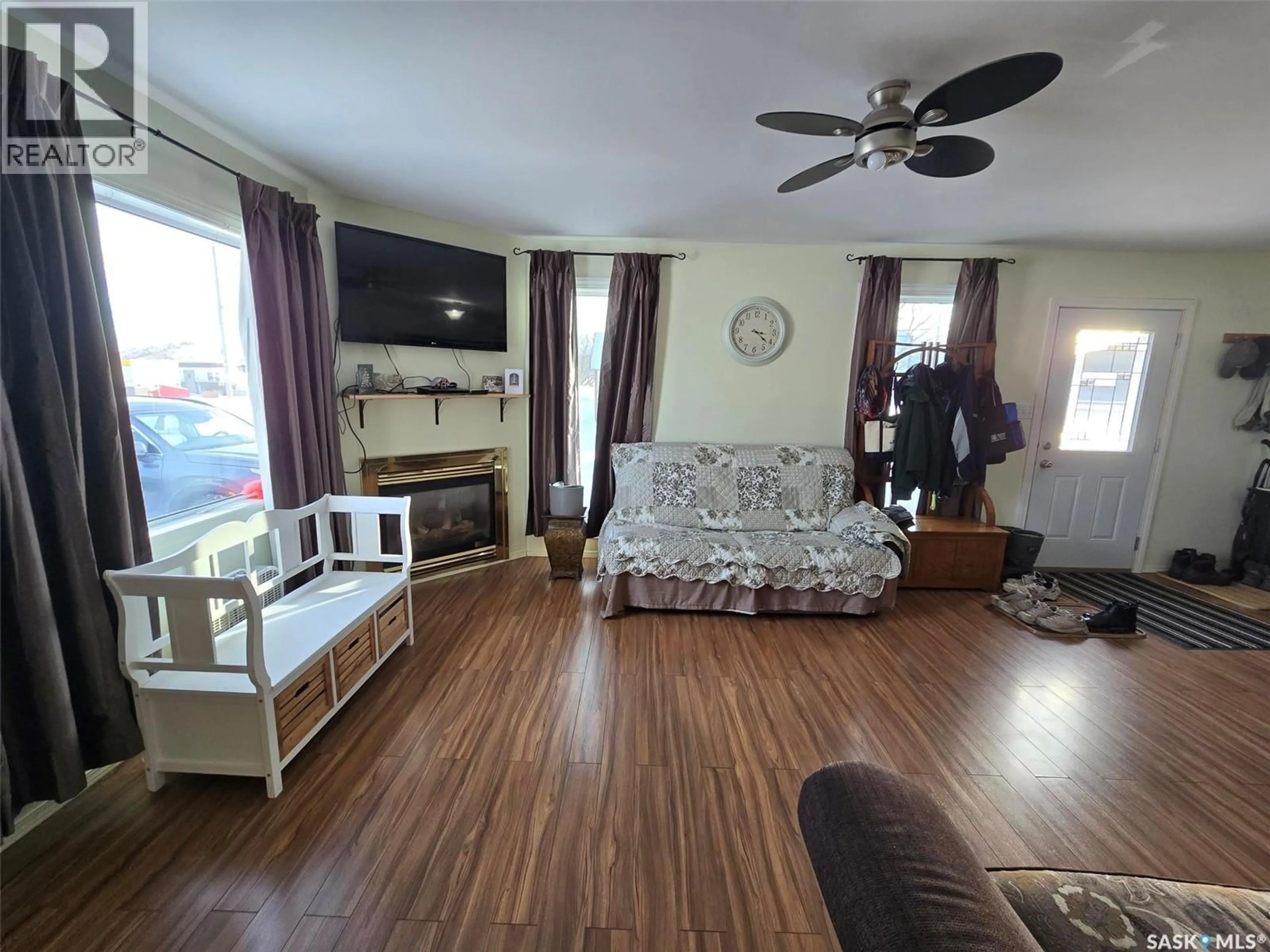 Living room with furniture, wood/laminate floor for 506 QU'APPELLE STREET, Grenfell Saskatchewan S0G2B0