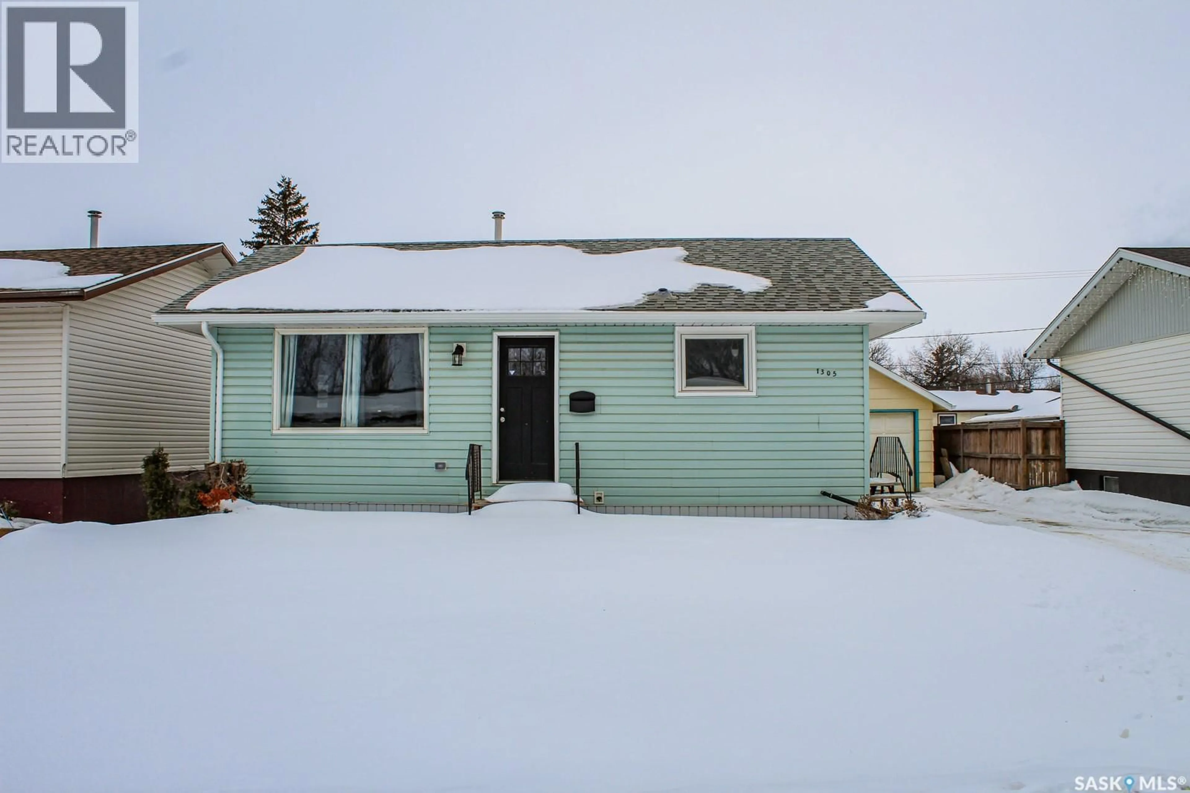 Home with vinyl exterior material, street for 1305 96TH STREET, Tisdale Saskatchewan S0E1T0