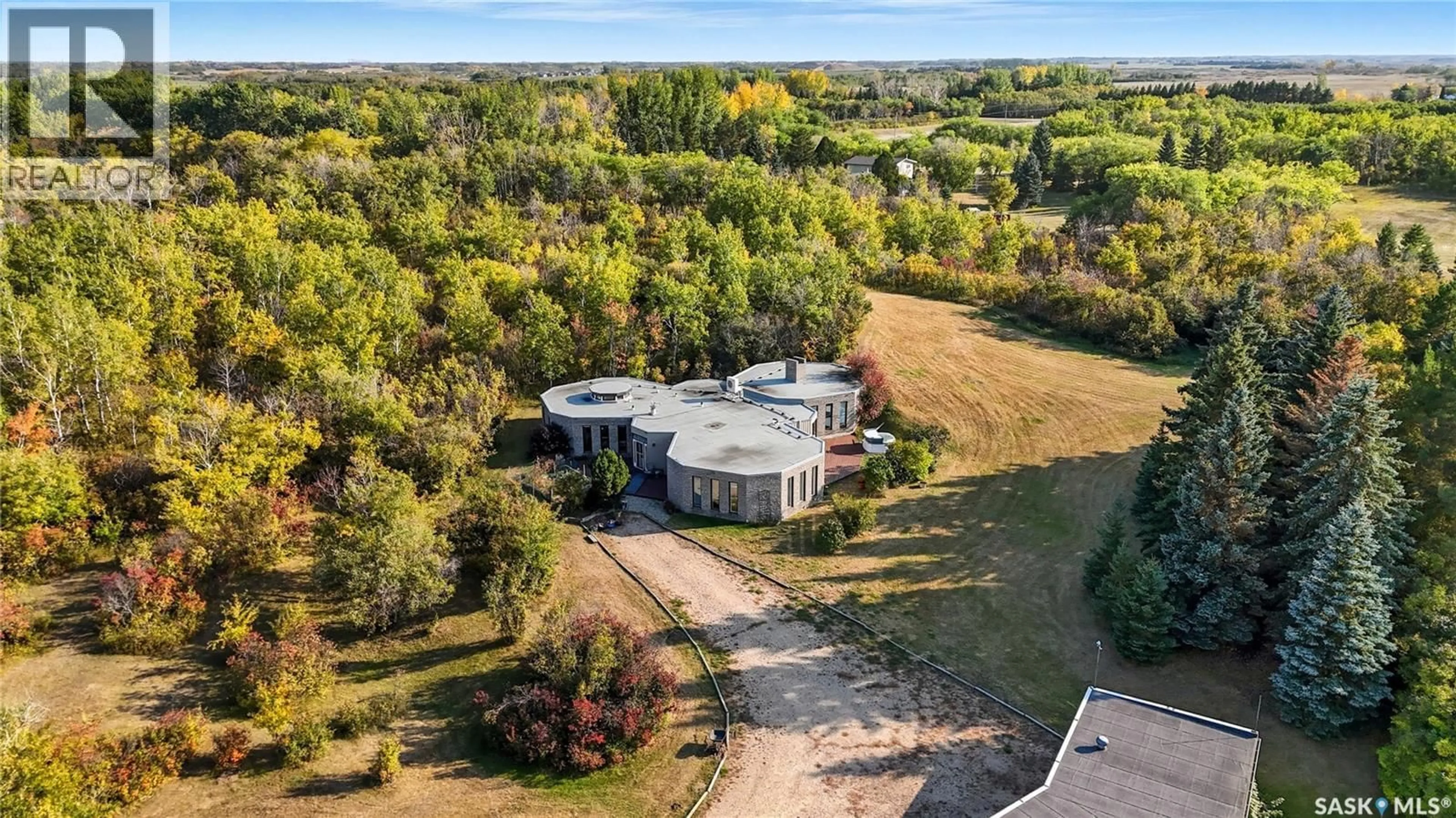 A pic from outside/outdoor area/front of a property/back of a property/a pic from drone, unknown for 1 PONY TRAIL, Corman Park Rm No. 344 Saskatchewan S7T1A4