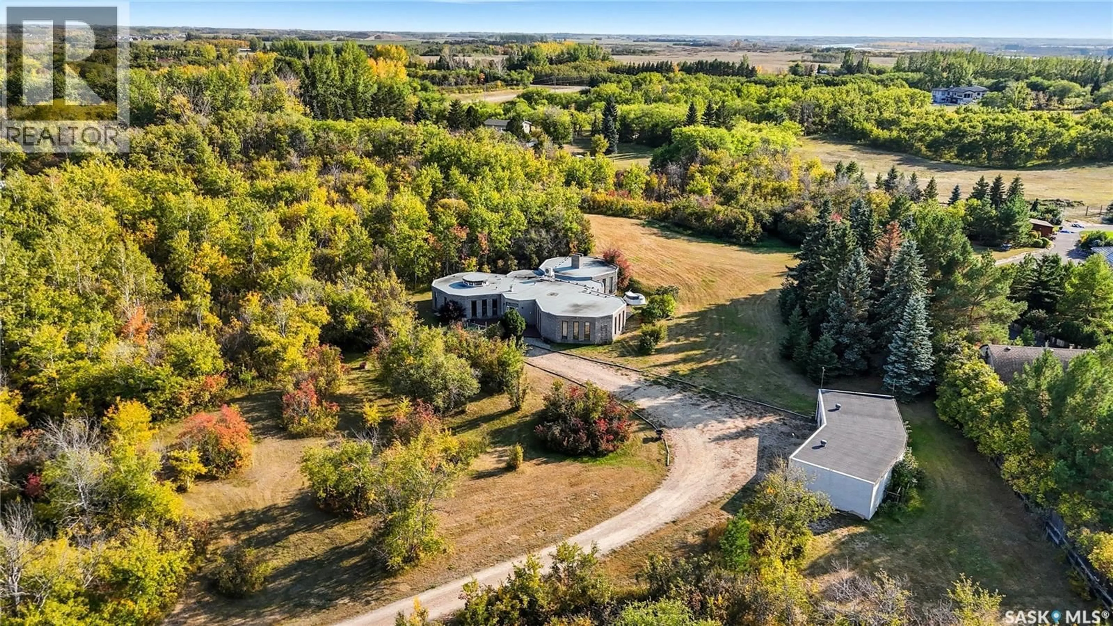A pic from outside/outdoor area/front of a property/back of a property/a pic from drone, unknown for 1 PONY TRAIL, Corman Park Rm No. 344 Saskatchewan S7T1A4