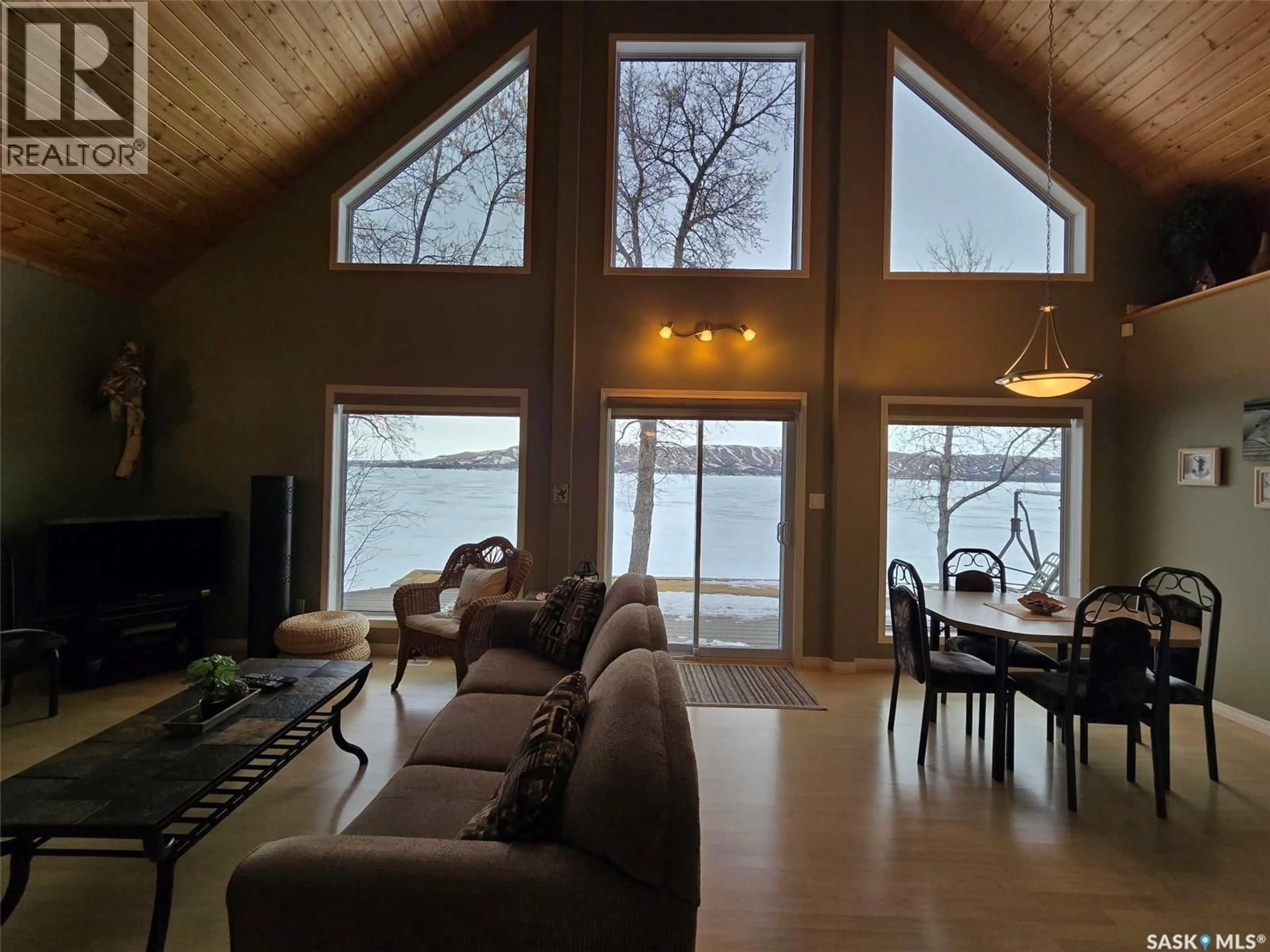 Living room with furniture, wood/laminate floor for 106 SEASHELL ROAD, Crooked Lake Saskatchewan S0G2B0