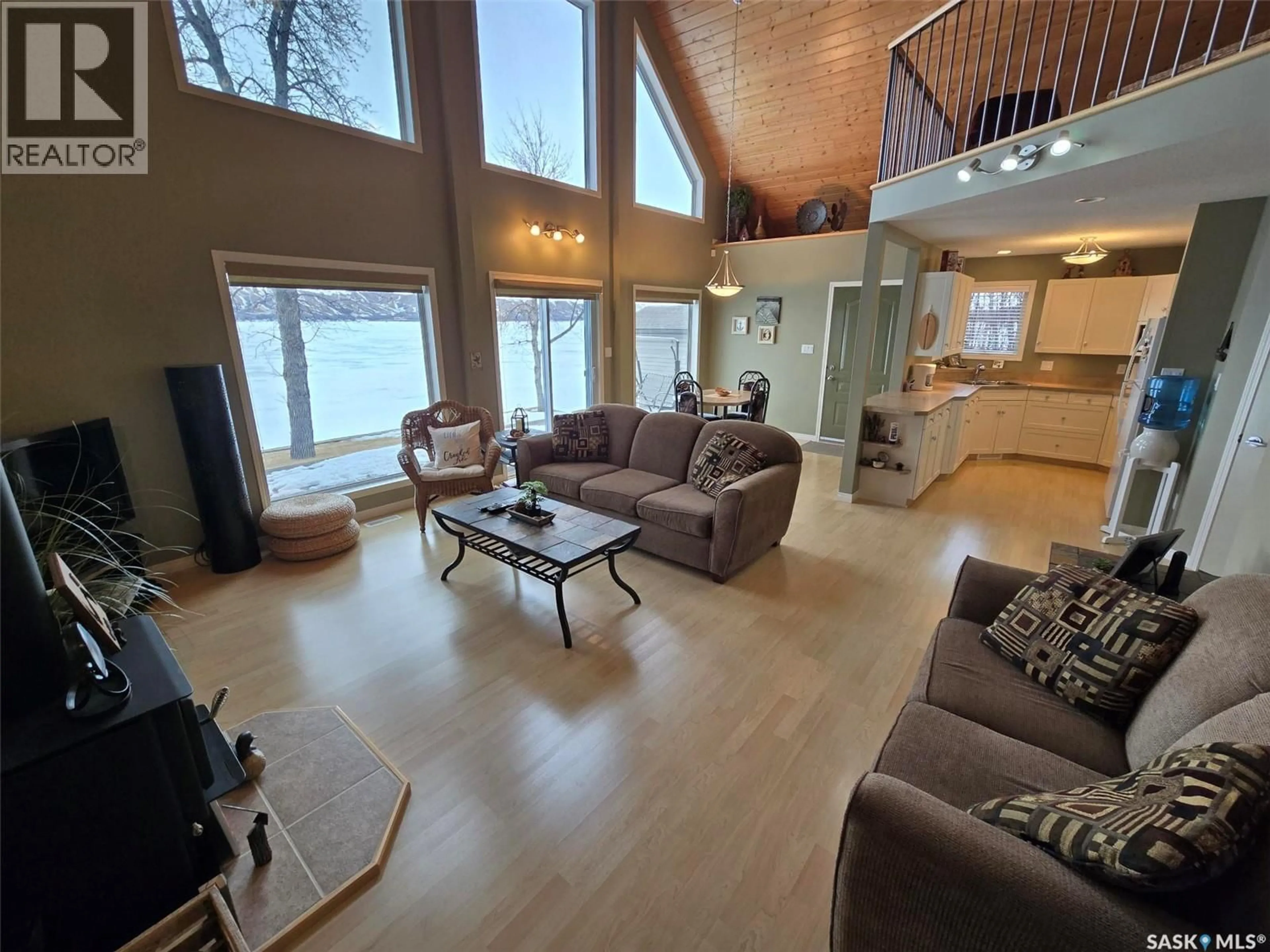 Living room with furniture, wood/laminate floor for 106 SEASHELL ROAD, Crooked Lake Saskatchewan S0G2B0