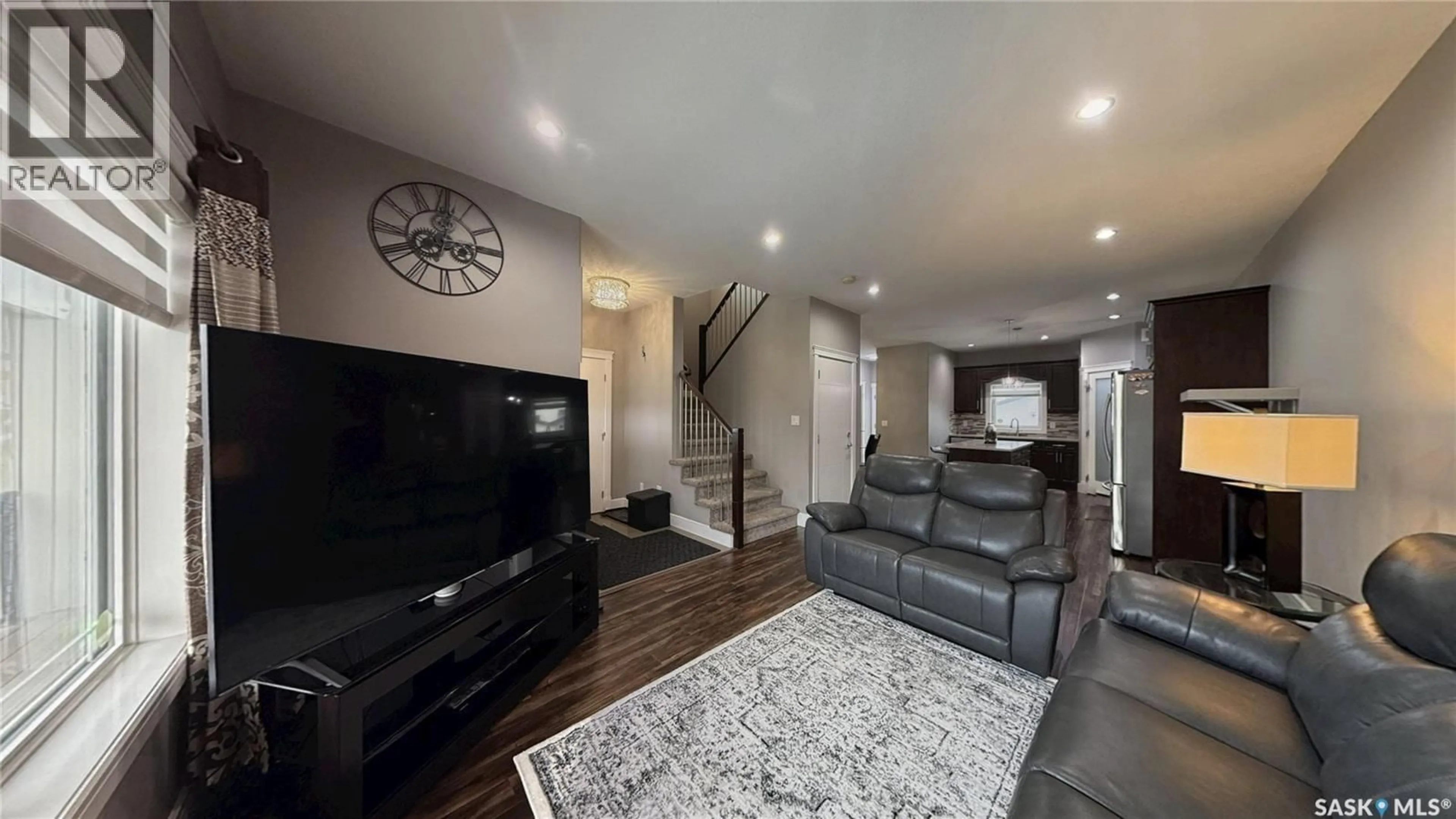 Living room with furniture, unknown for 414 ELLS WAY, Saskatoon Saskatchewan S7L6K6