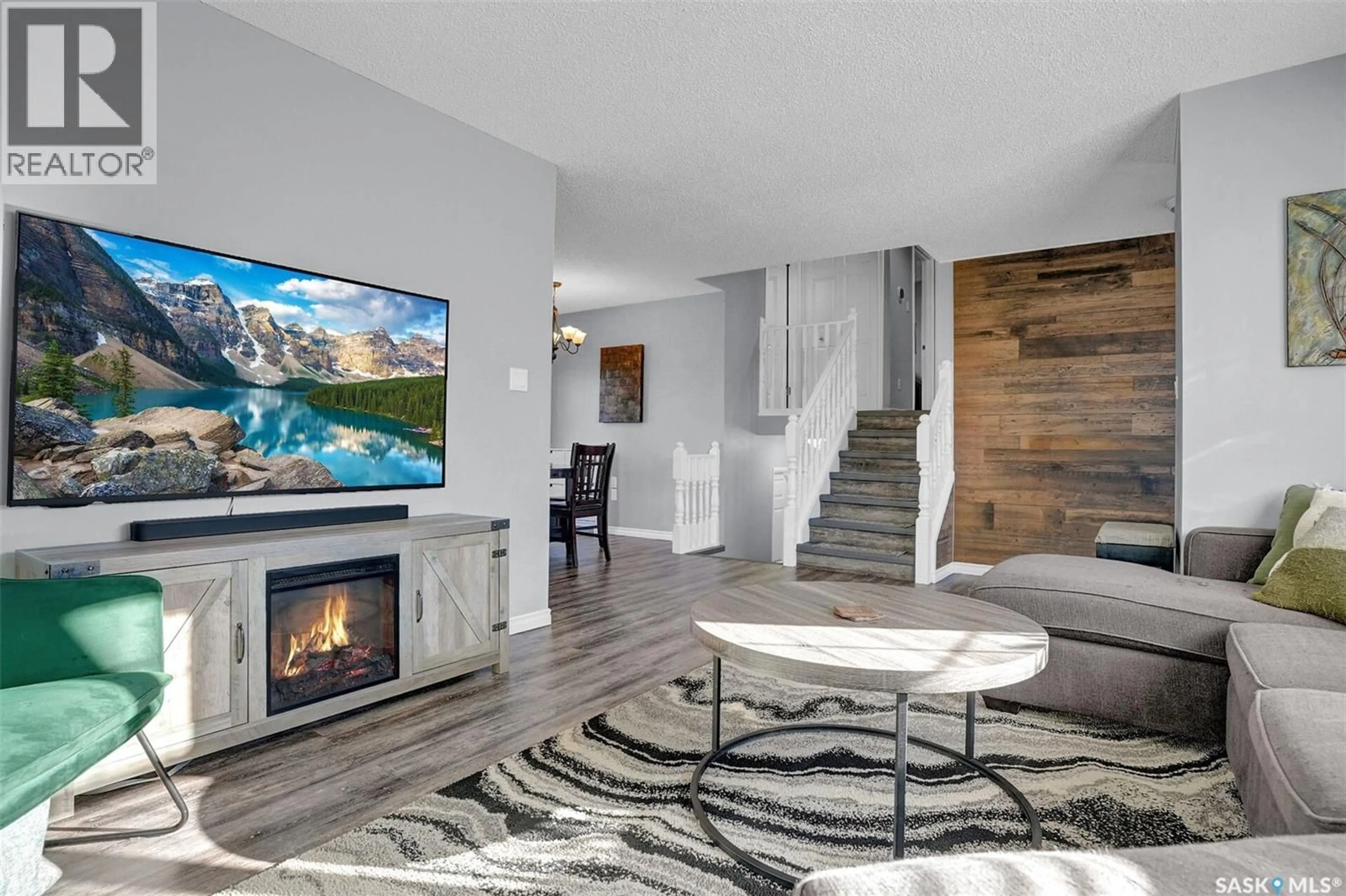 Living room with furniture, wood/laminate floor for 590 RINK AVENUE, Regina Saskatchewan S4X2E9