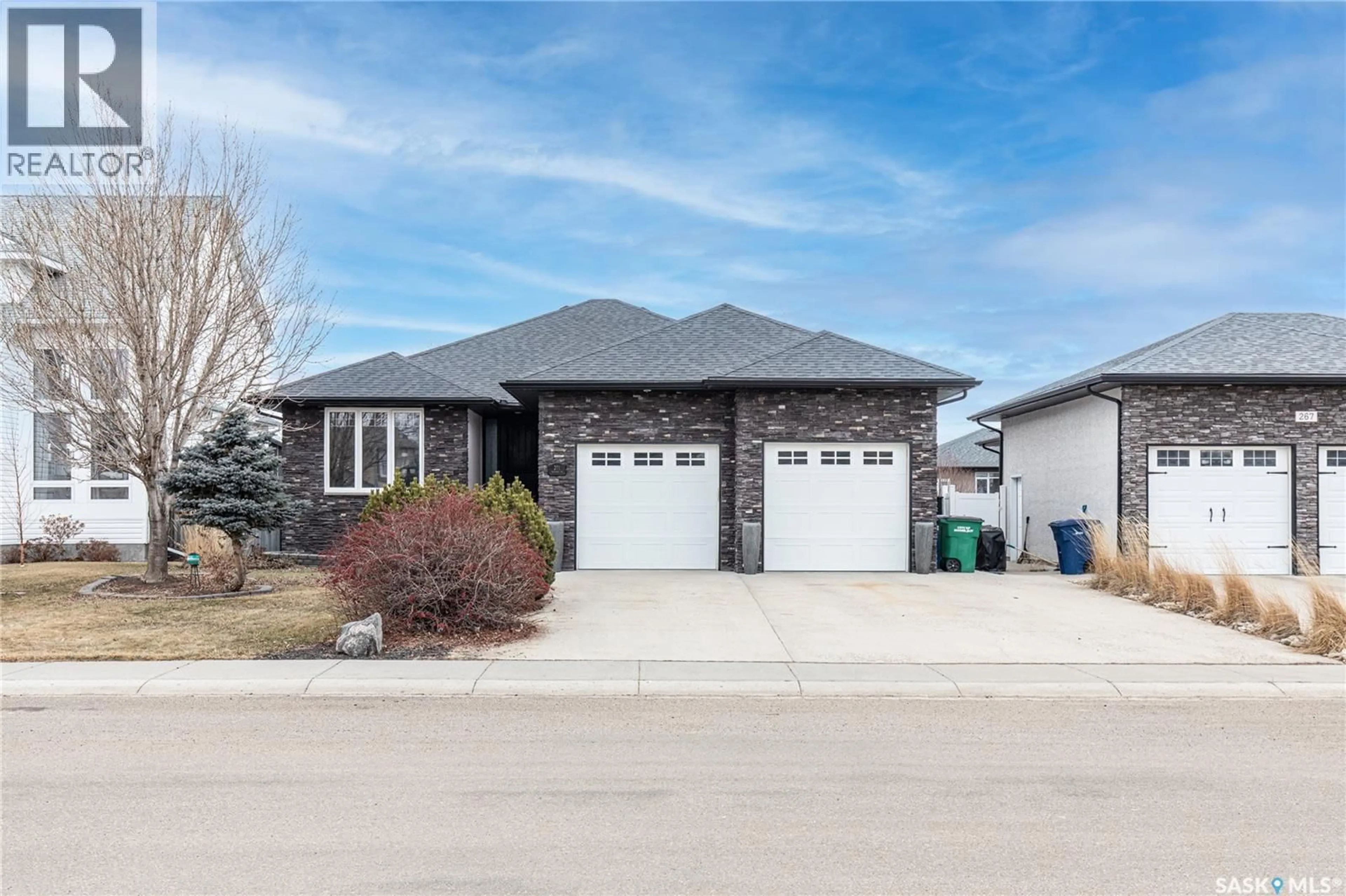 Home with brick exterior material, street for 271 BLUE SAGE DRIVE, Moose Jaw Saskatchewan S6J1N5