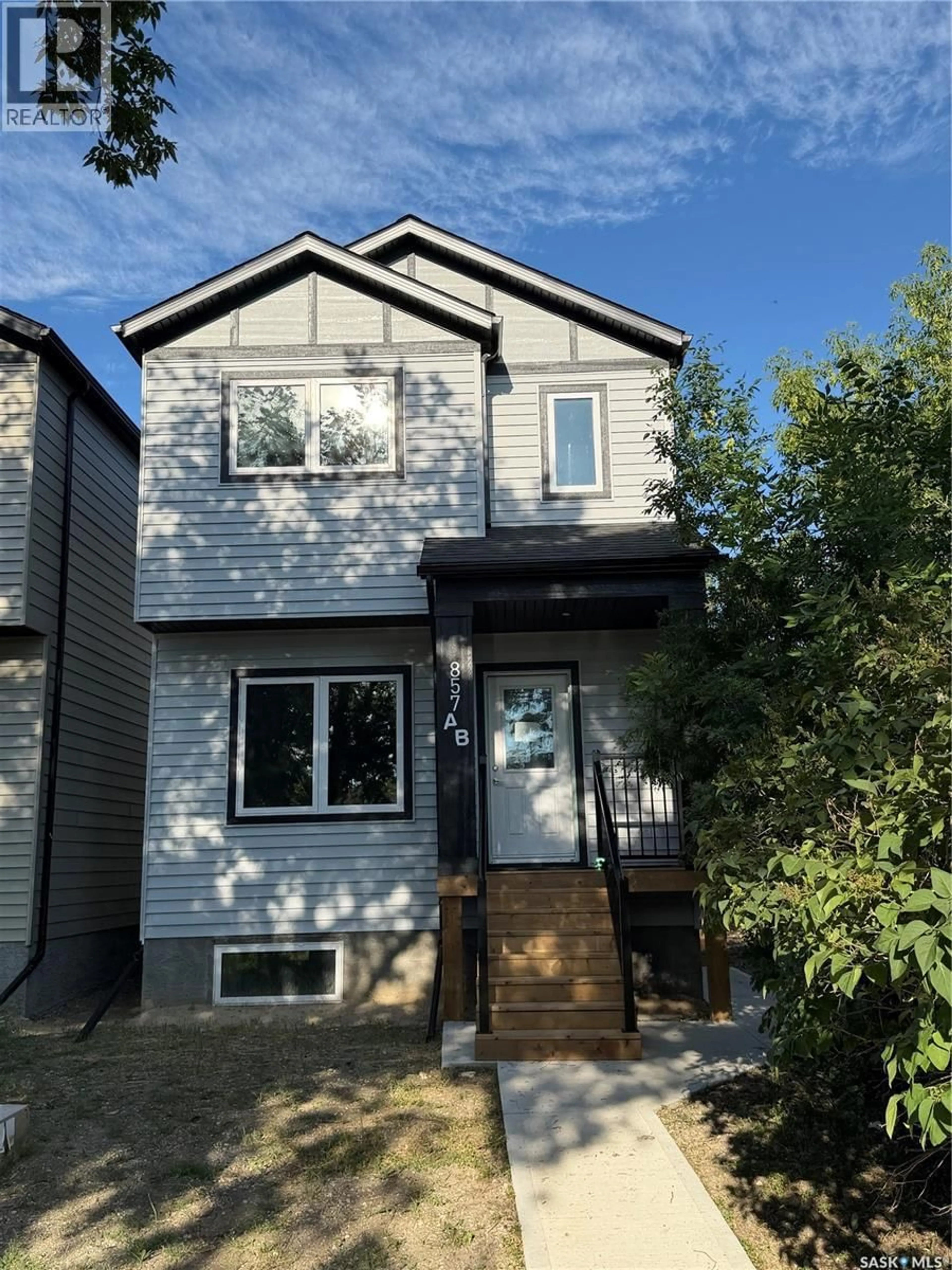Home with vinyl exterior material, street for 857 ELLIOTT STREET, Regina Saskatchewan S4N3E3