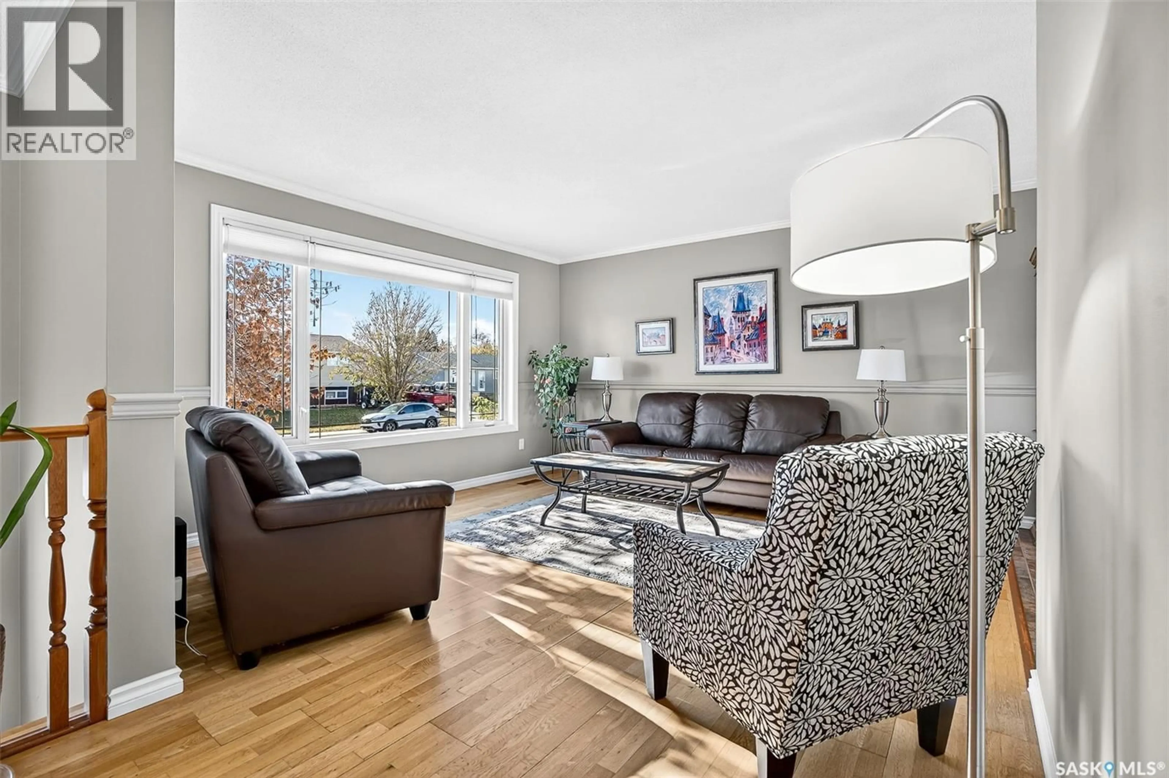 Living room with furniture, wood/laminate floor for 1646 SMITH STREET, Moose Jaw Saskatchewan S6H1A8