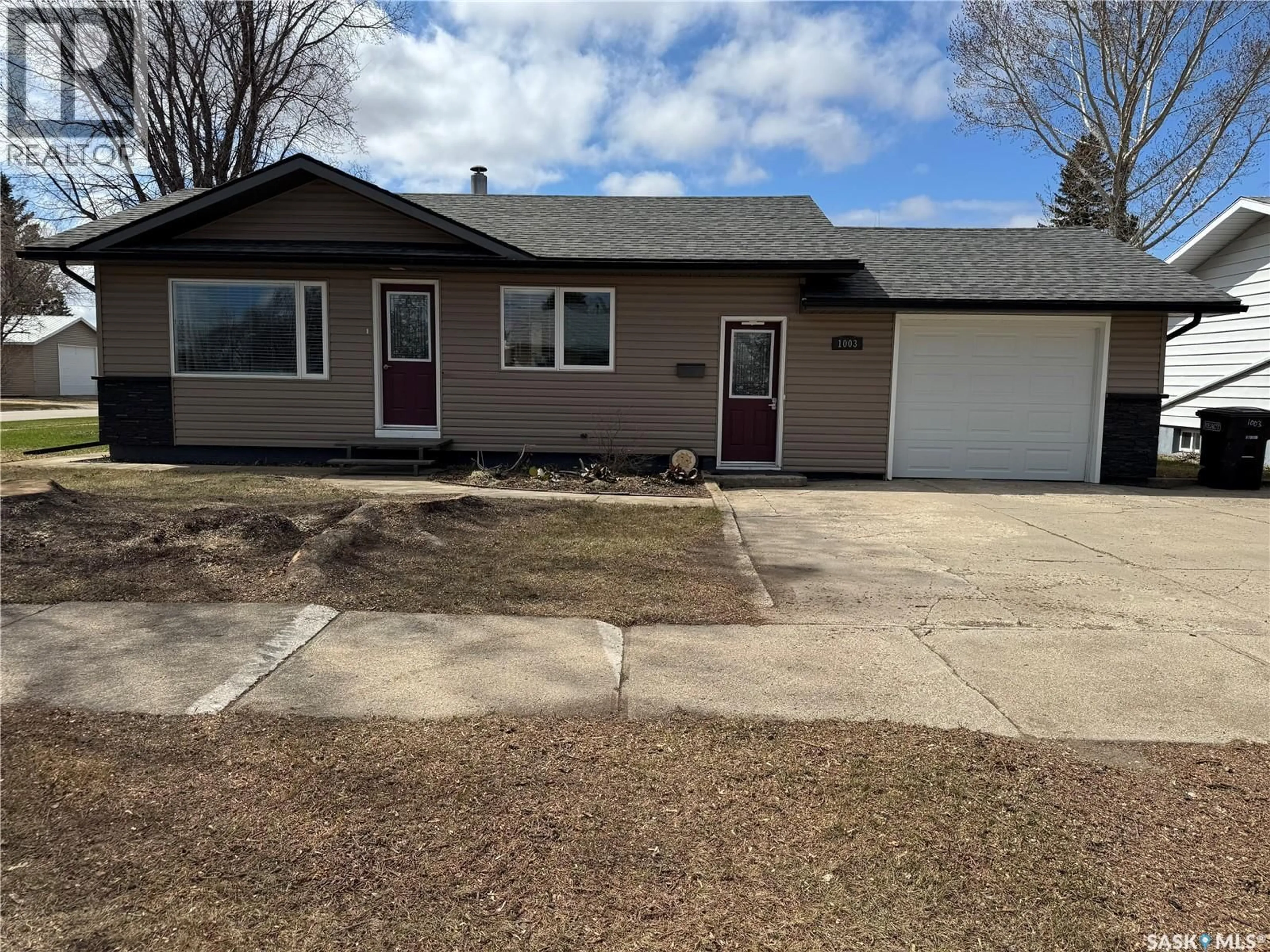 Home with vinyl exterior material, street for 1003 11TH STREET, Humboldt Saskatchewan S0K2A0