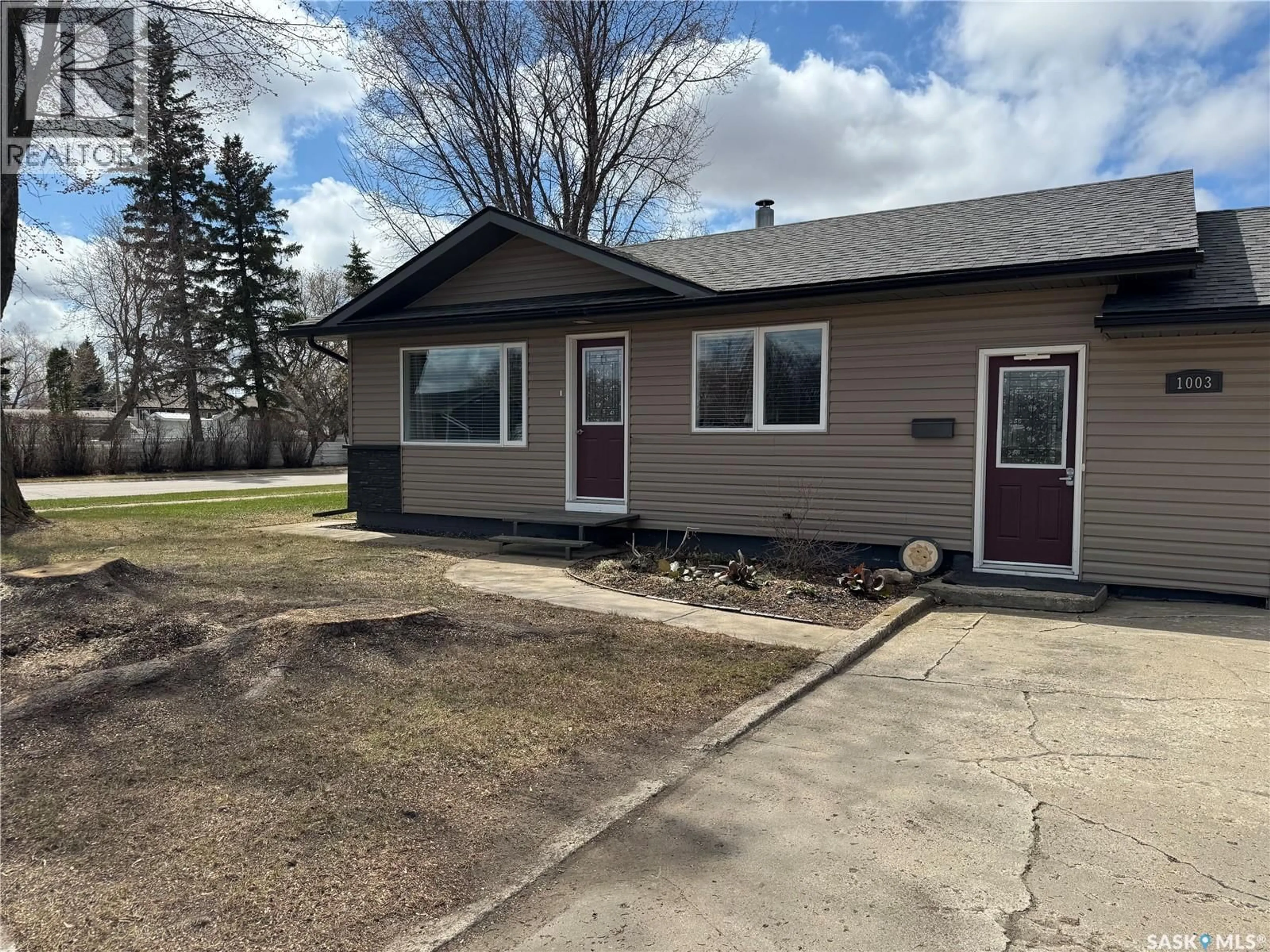 Home with vinyl exterior material, street for 1003 11TH STREET, Humboldt Saskatchewan S0K2A0
