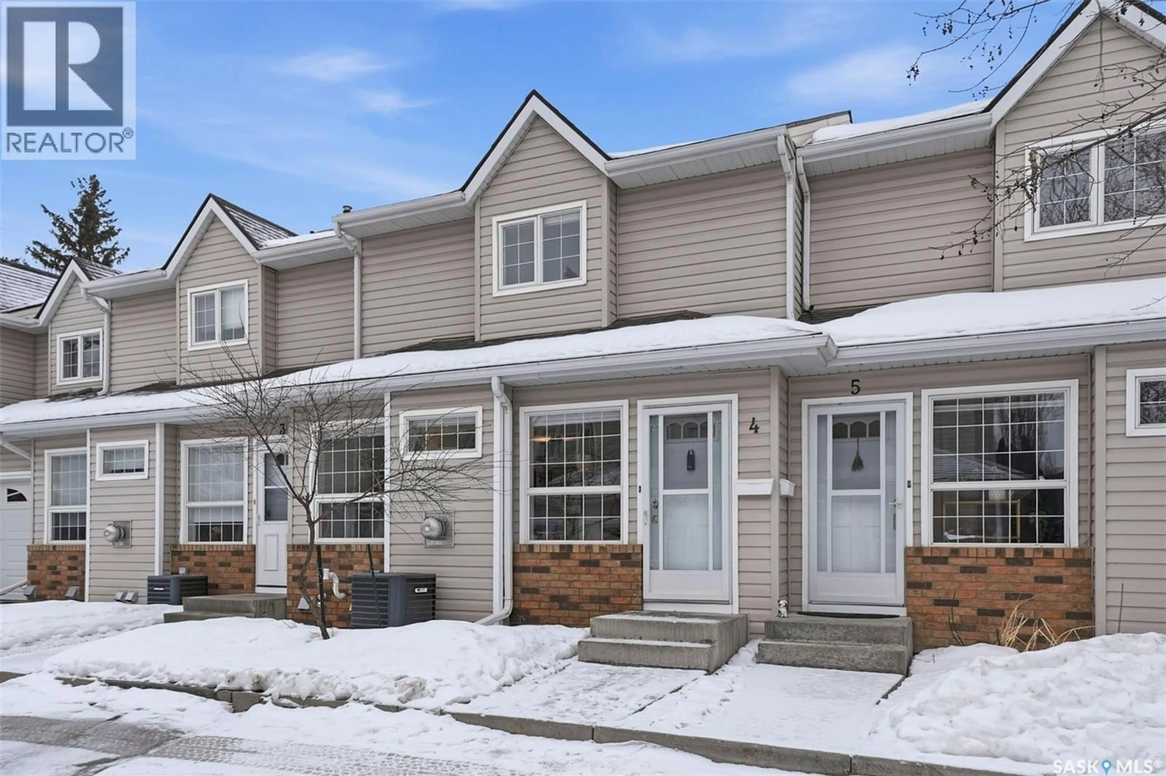 Home with vinyl exterior material, street for 102 - 4 WILLOW STREET, Saskatoon Saskatchewan S7J0C2