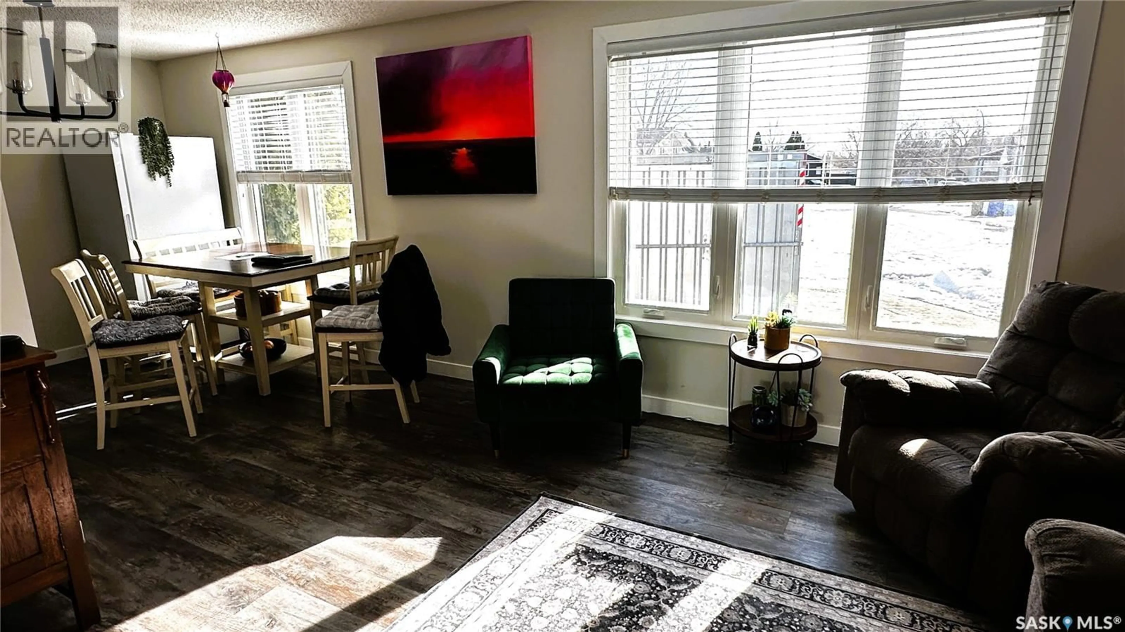 Living room with furniture, wood/laminate floor for 1026 MAWSON BAY N, Regina Saskatchewan S4X2P6