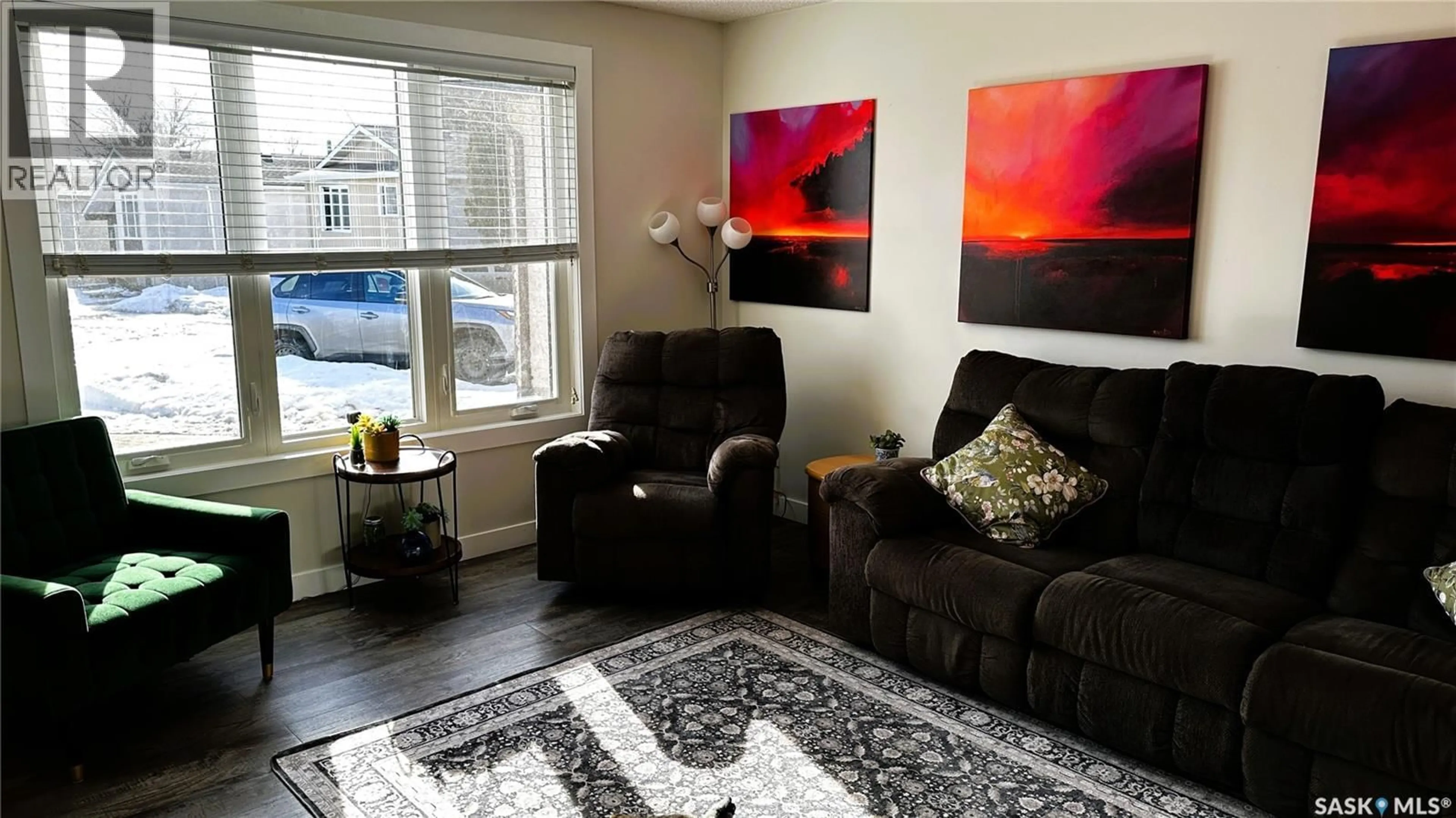 Living room with furniture, wood/laminate floor for 1026 MAWSON BAY N, Regina Saskatchewan S4X2P6