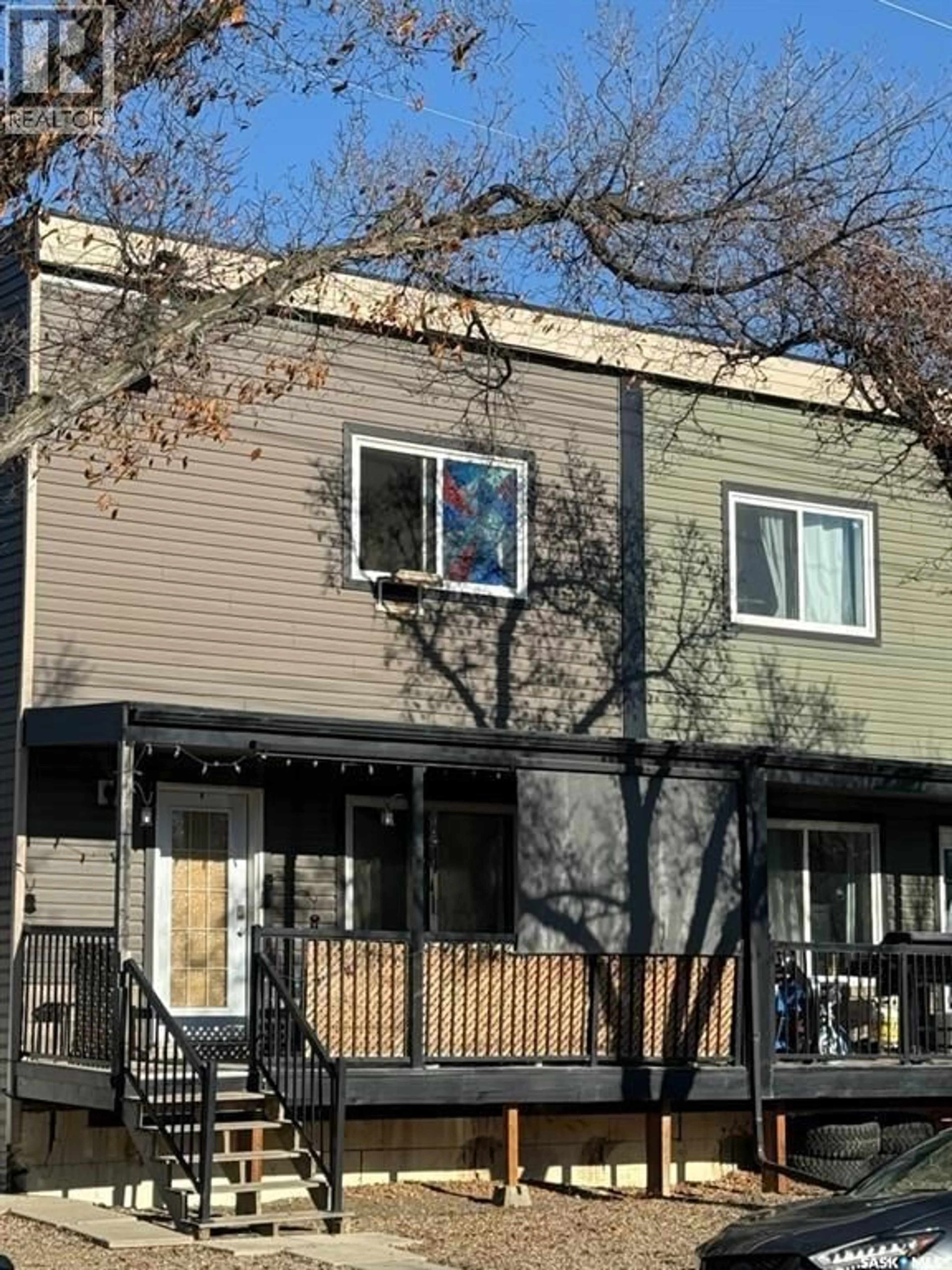 Home with vinyl exterior material, street for 118 5TH AVENUE, Kindersley Saskatchewan S0L1S0