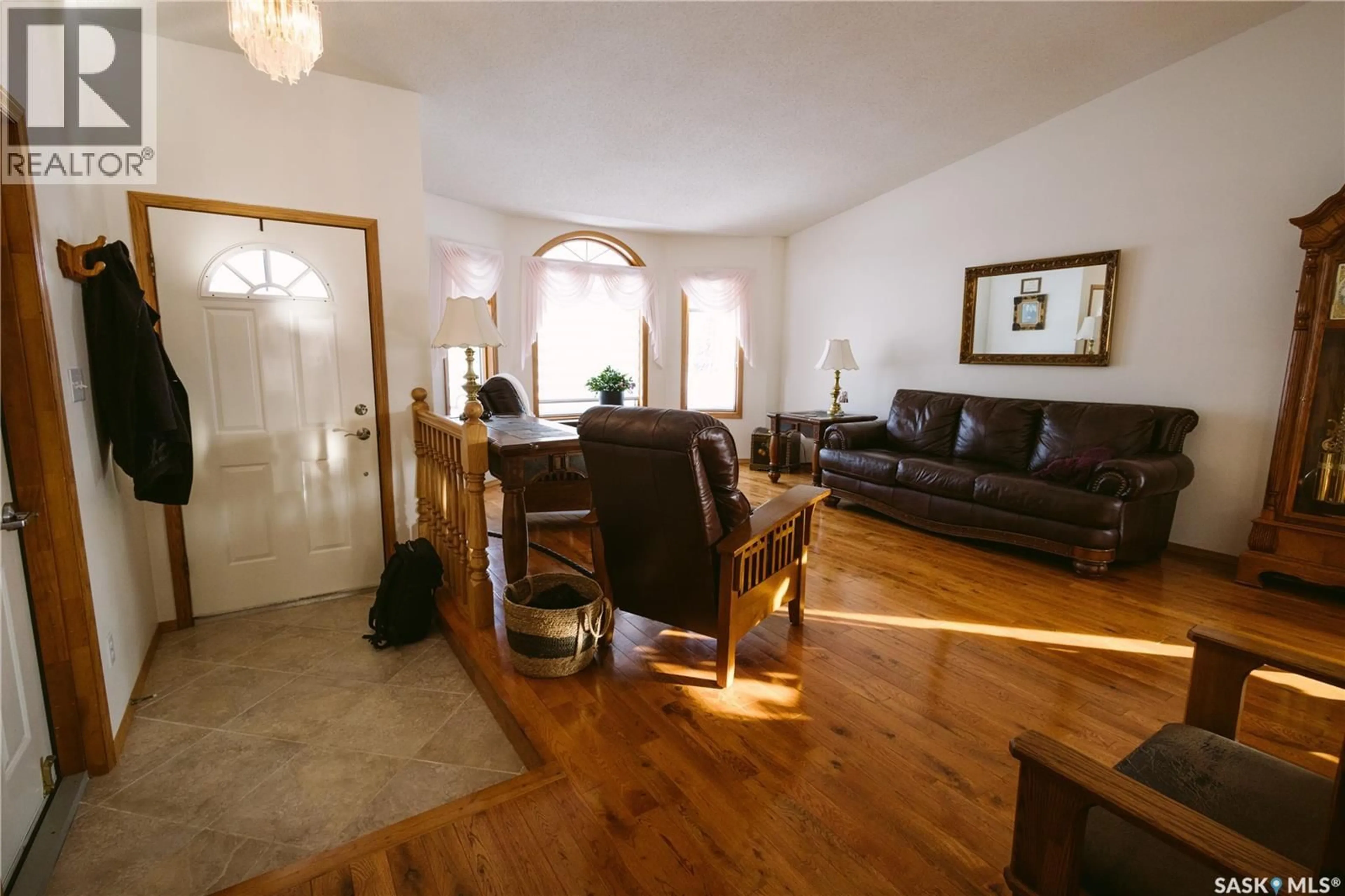 Living room with furniture, wood/laminate floor for 736 SASKATCHEWAN AVENUE, Foam Lake Saskatchewan S0A1A0