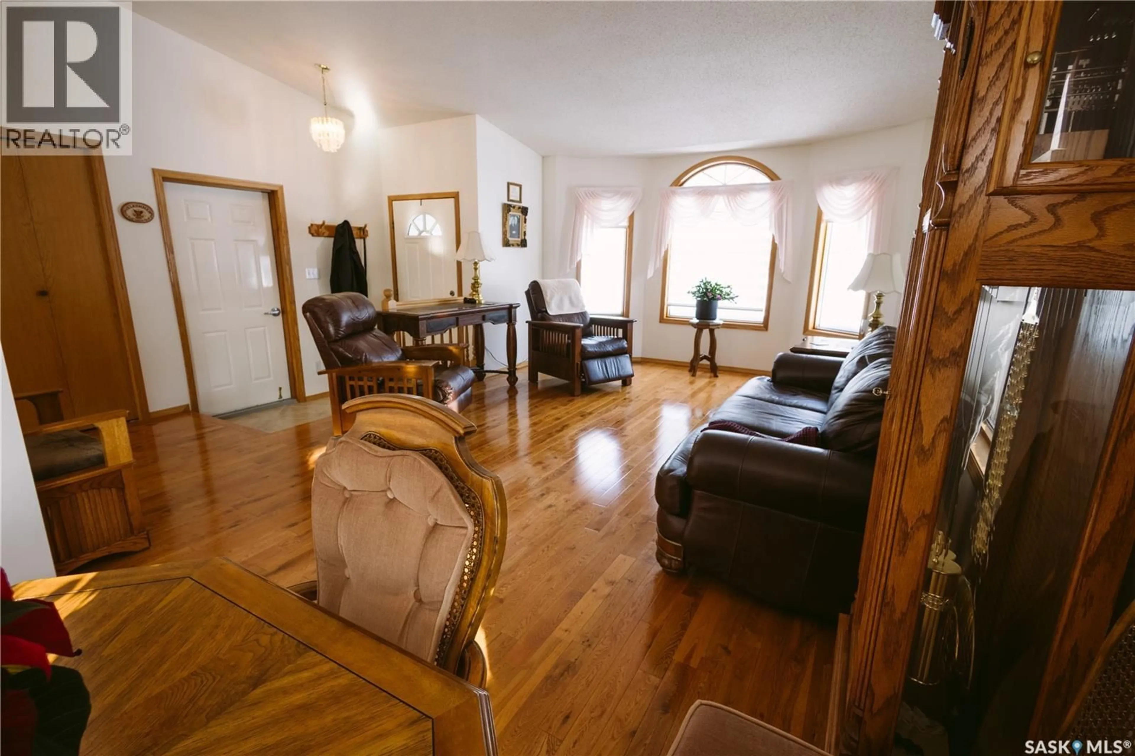 Living room with furniture, wood/laminate floor for 736 SASKATCHEWAN AVENUE, Foam Lake Saskatchewan S0A1A0