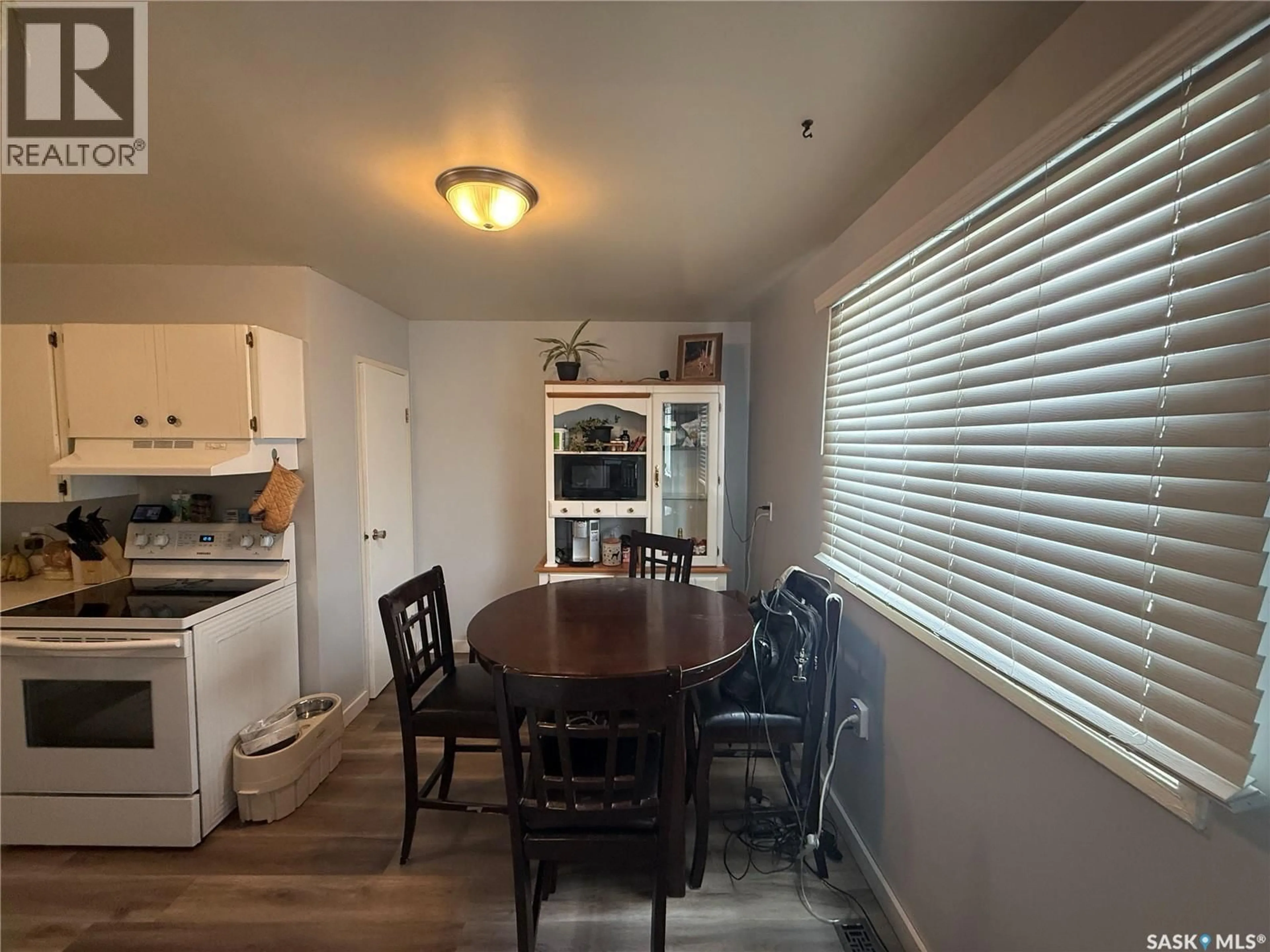 Dining room, wood/laminate floor for 104 MAIN STREET, Watson Saskatchewan S0K4V0