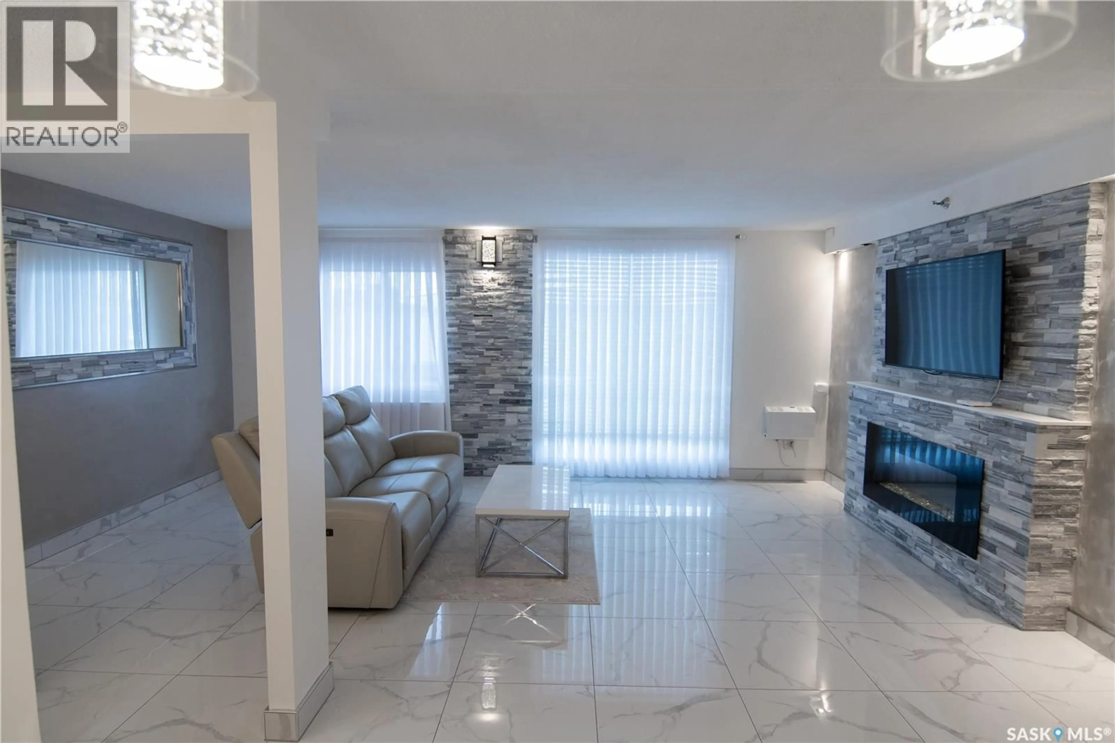 Living room with furniture, ceramic/tile floor for 221 4045 RAE STREET, Regina Saskatchewan S4S6Y8