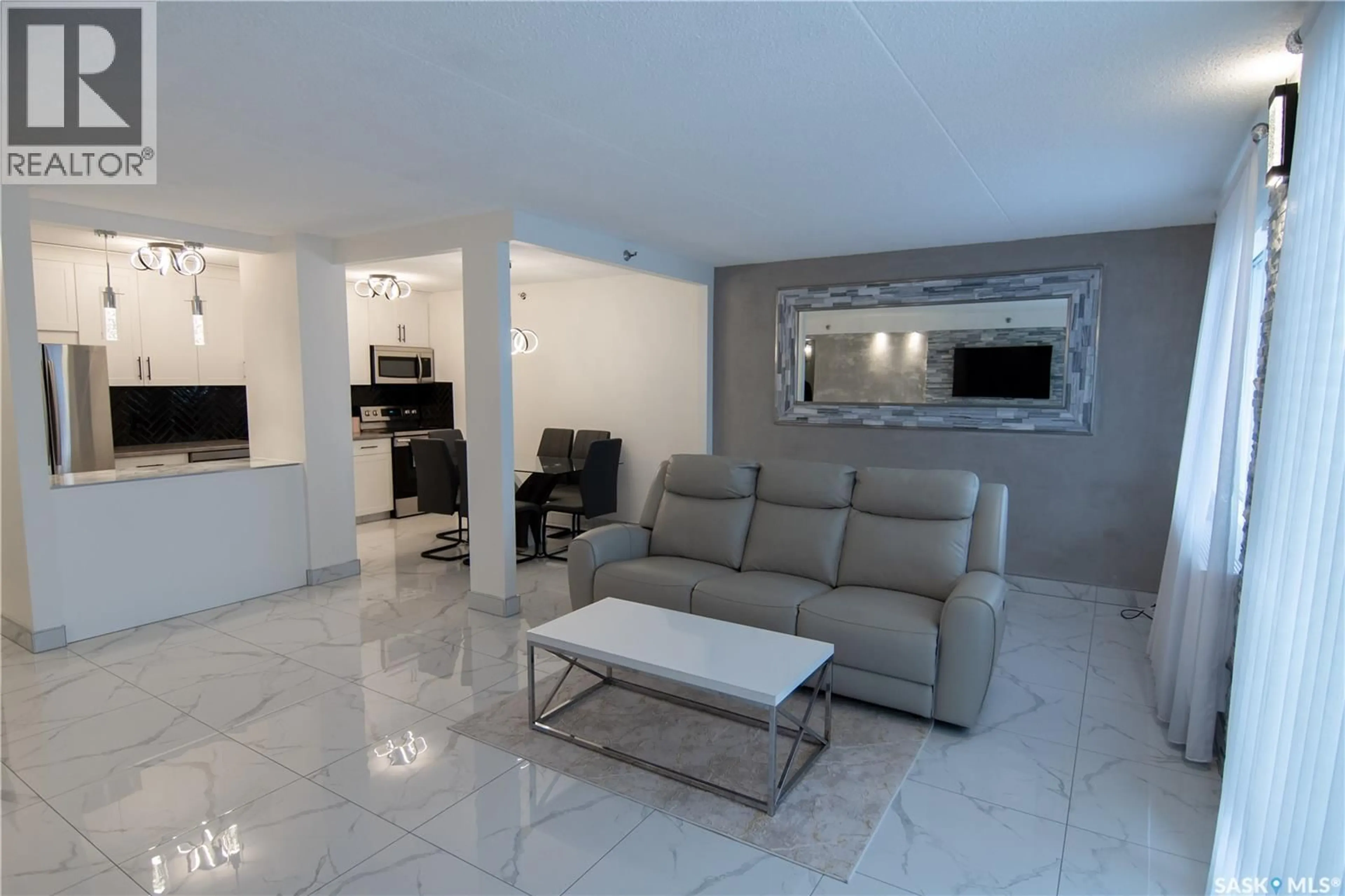 Living room with furniture, ceramic/tile floor for 221 4045 RAE STREET, Regina Saskatchewan S4S6Y8