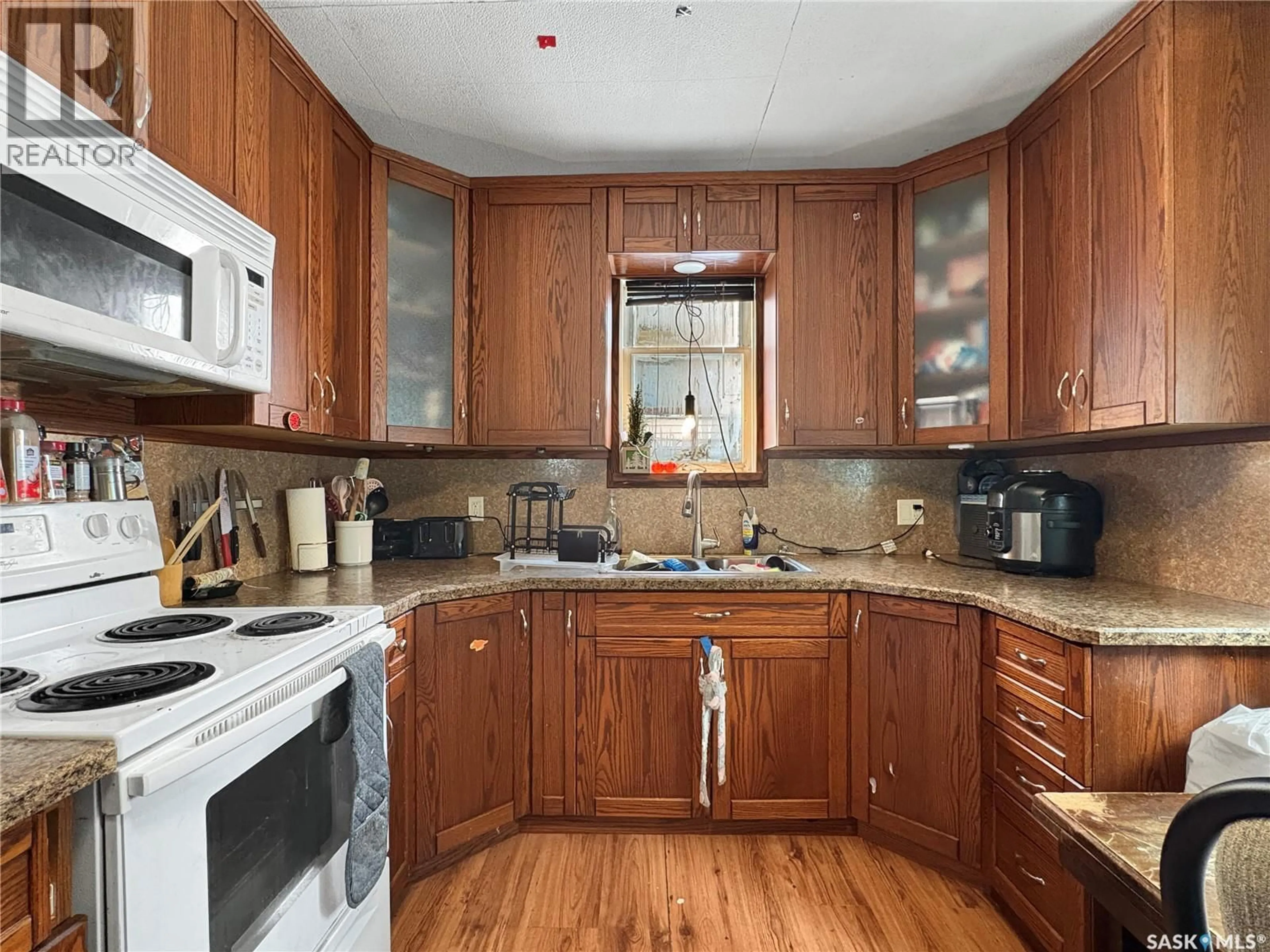 Standard kitchen, wood/laminate floor for 1062 104TH STREET, North Battleford Saskatchewan S9A1N4