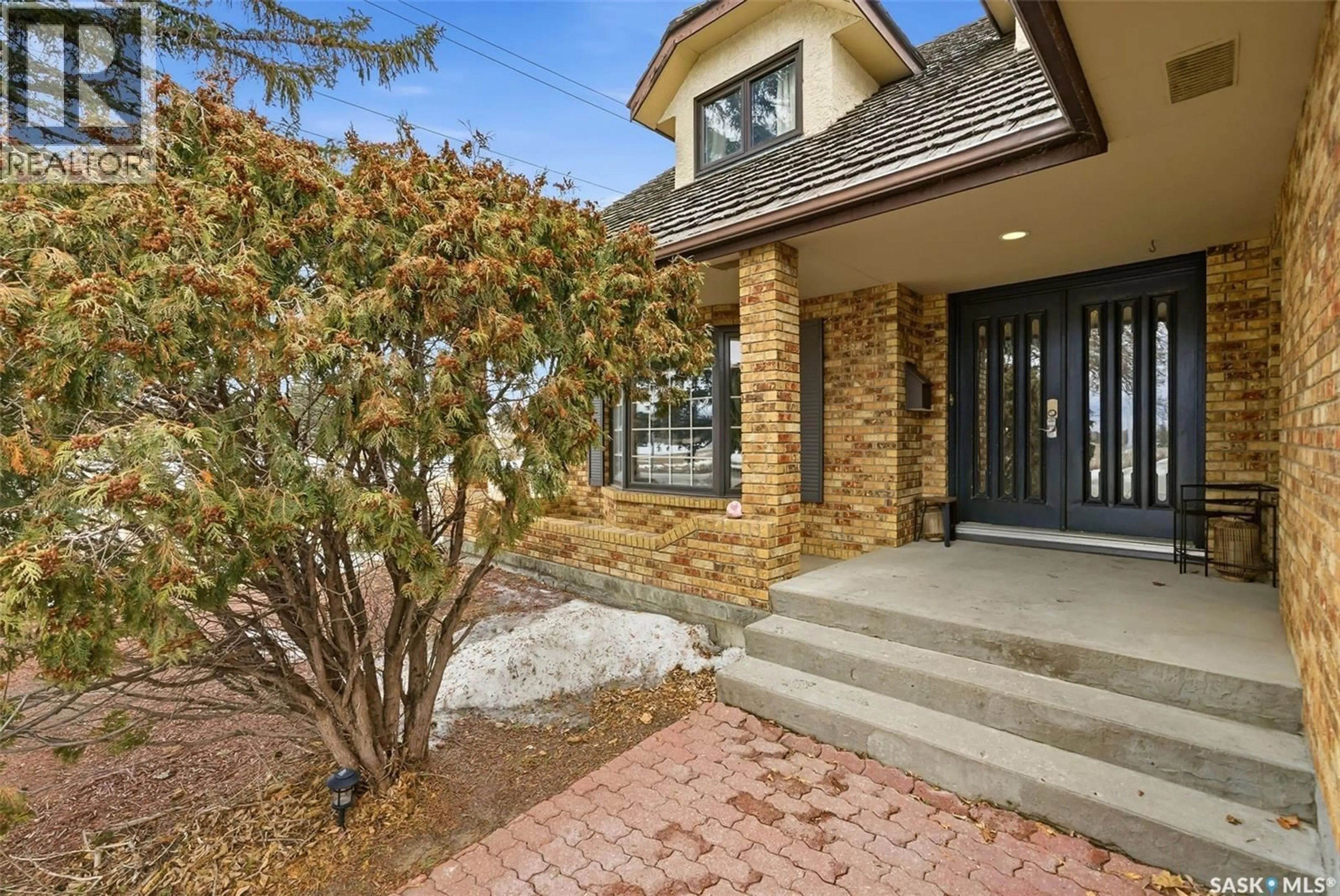 Home with brick exterior material, street for 2402 TRUESDALE DRIVE, Regina Saskatchewan S4V0W2