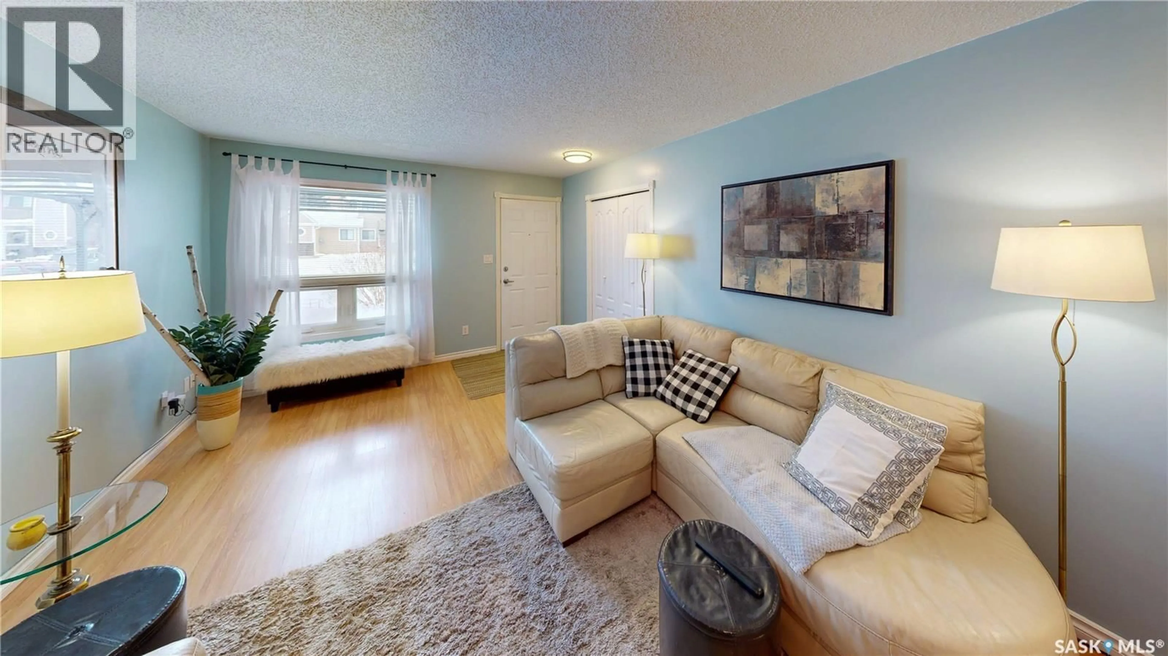 Living room with furniture, wood/laminate floor for 196 CEDAR MEADOW DRIVE, Regina Saskatchewan S4X3J6